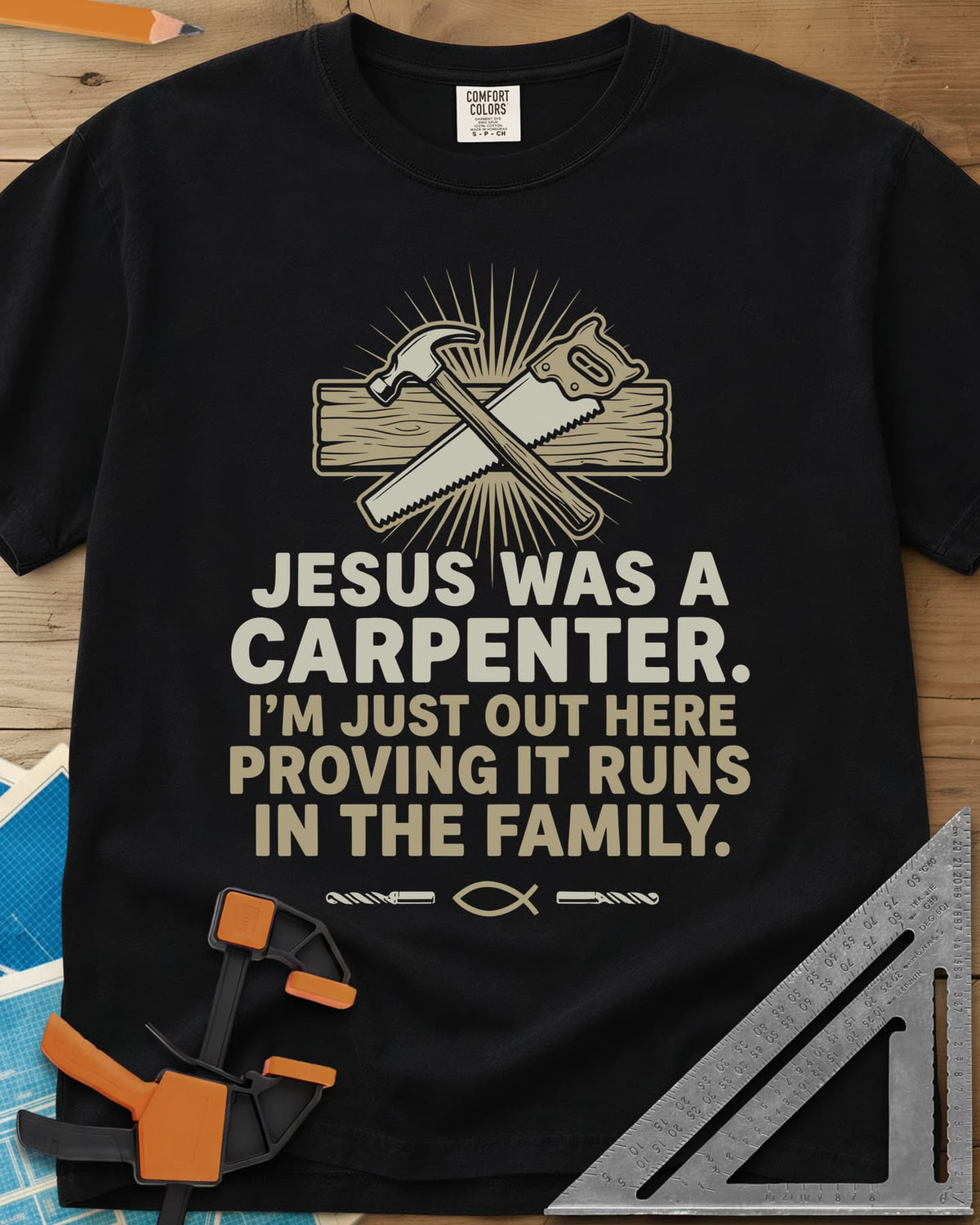 Runs In The Family Jesus Carpenter heavyweight tee in Black, crossed hammer and handsaw over a plank, with a small fish