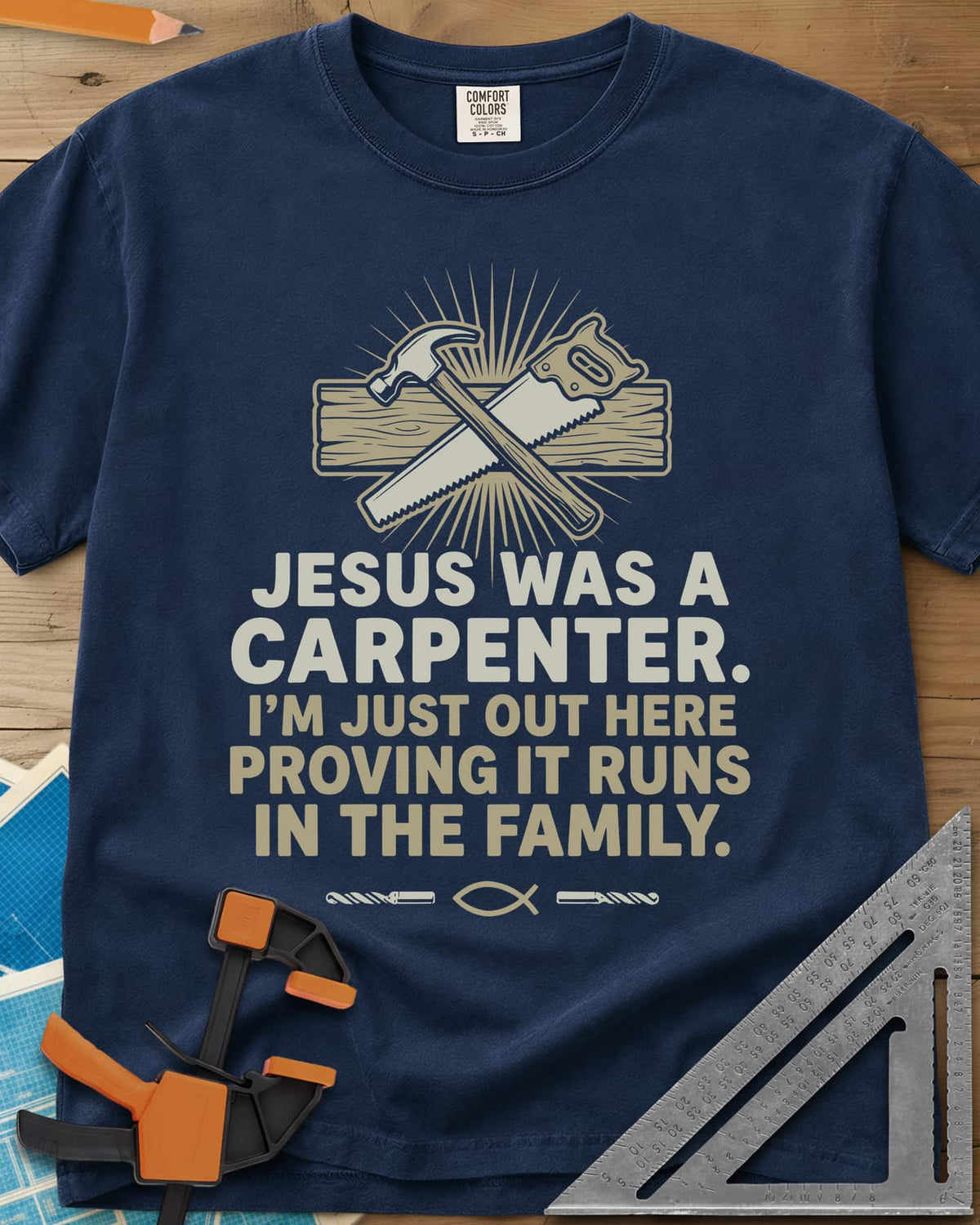 Runs In The Family Jesus Carpenter heavyweight tee in Navy, crossed hammer and handsaw over a plank, with a small fish symbol
