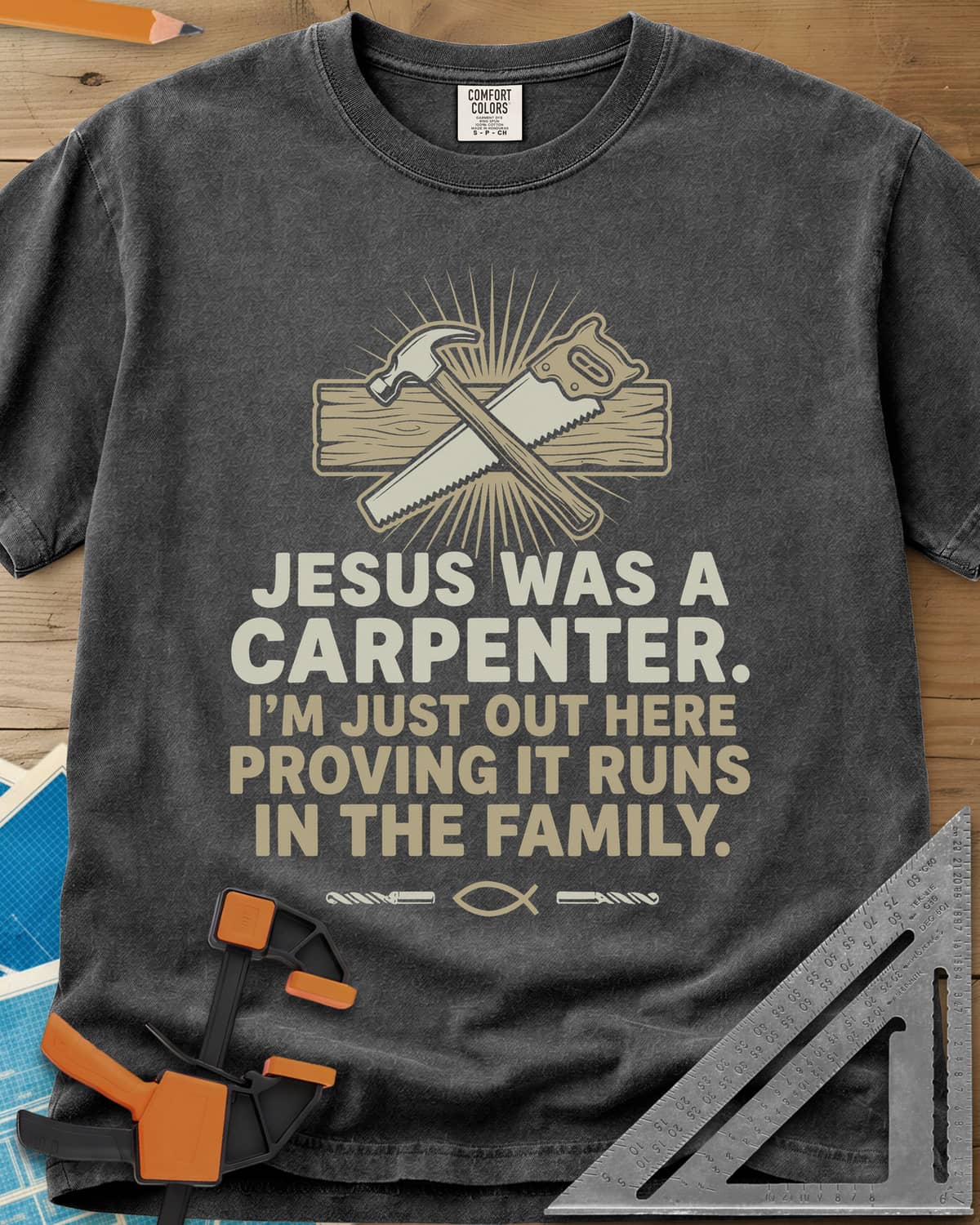 Runs In The Family Jesus Carpenter heavyweight tee in Pepper, crossed hammer and handsaw over a plank, with a small fish