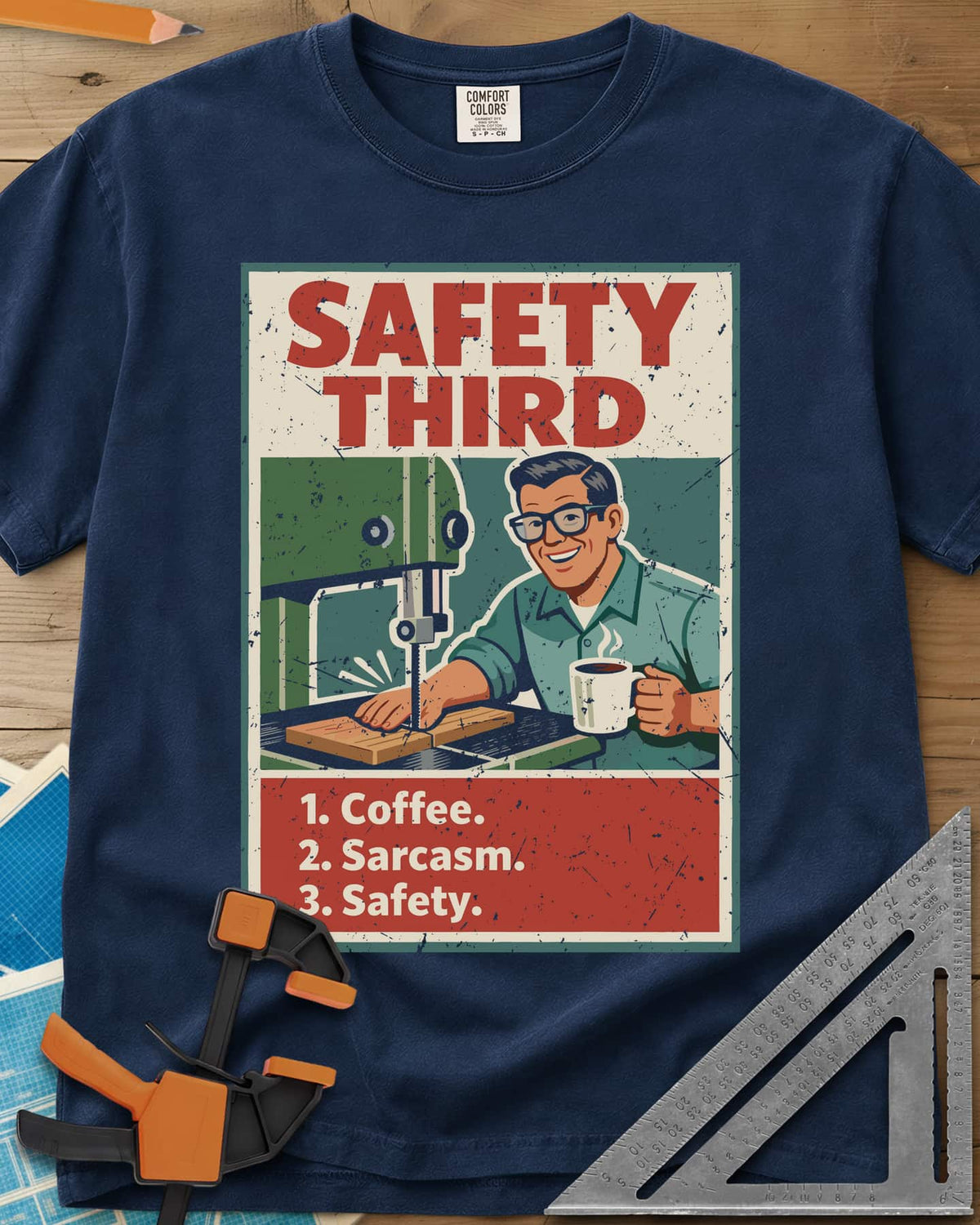 Safety Third heavyweight tee in Navy, retro poster of a smiling man at a band saw holding a coffee mug