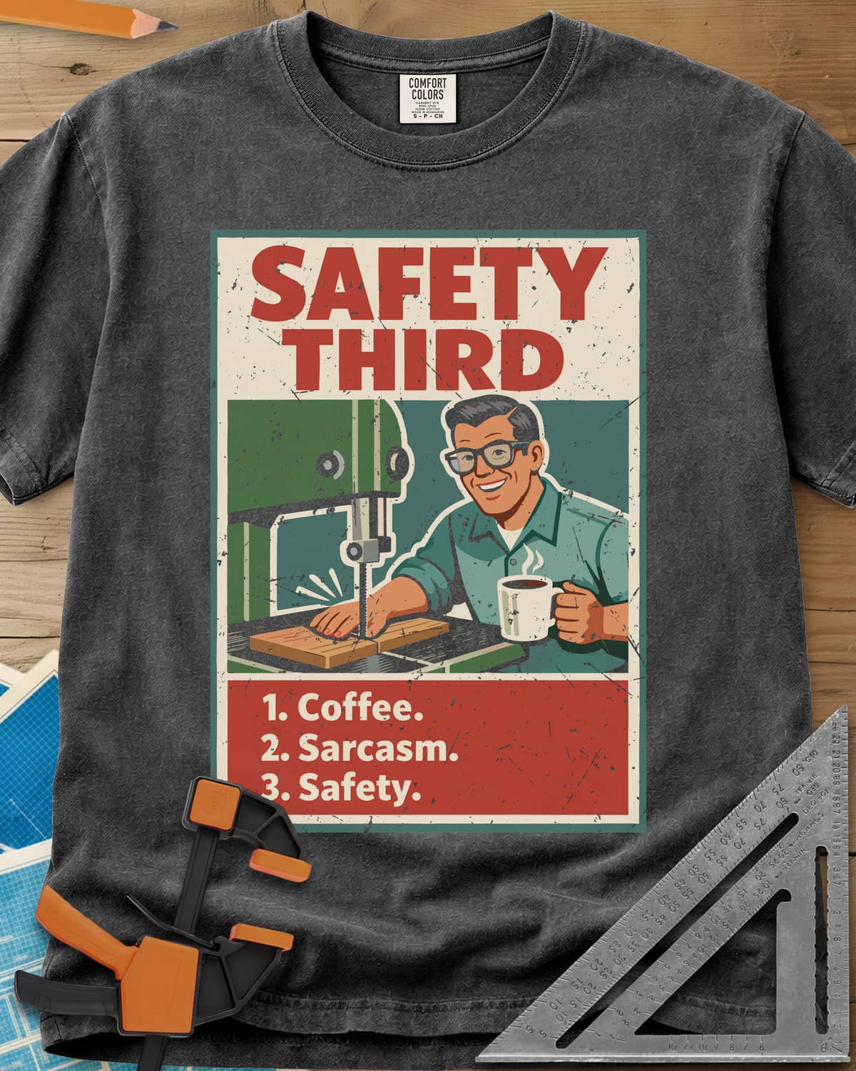 Safety Third heavyweight tee in Pepper, retro poster of a smiling man at a band saw holding a coffee mug
