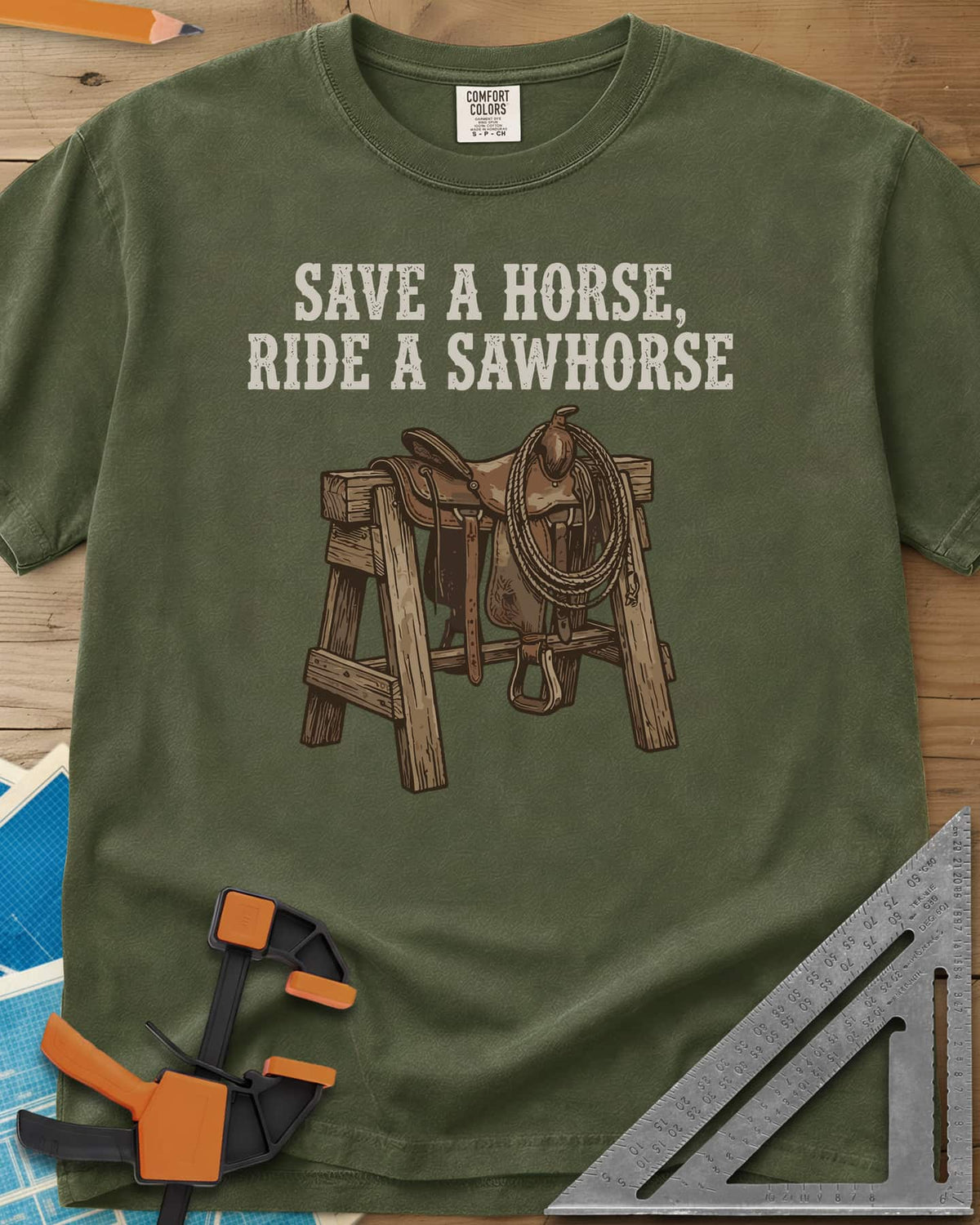 Save a Horse heavyweight tee in Hemp, a western saddle and lasso rope draped over a wooden sawhorse
