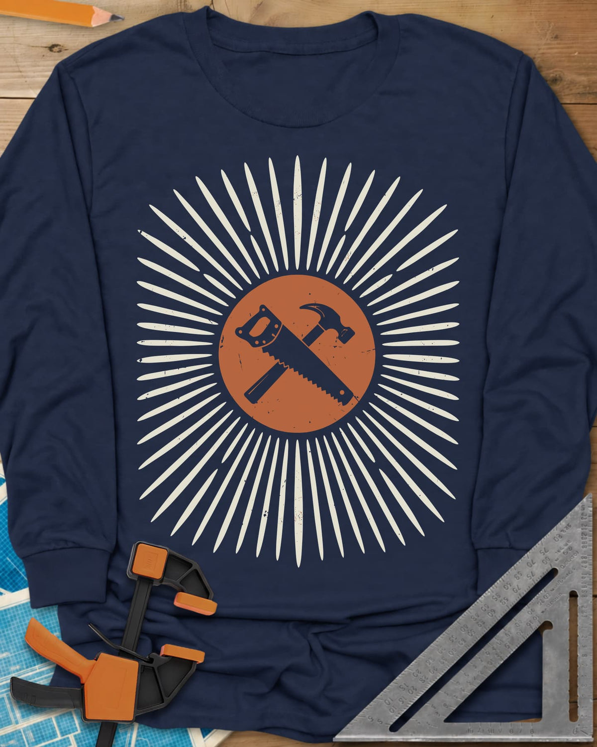 Saw & Hammer long sleeve shirt in Navy, crossed handsaw and hammer on a rust circle in a sunburst of rays