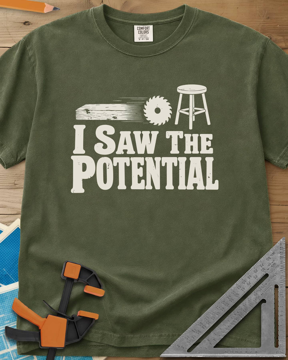 Saw The Potential heavyweight tee in Hemp, a speeding plank, a saw blade and a finished stool