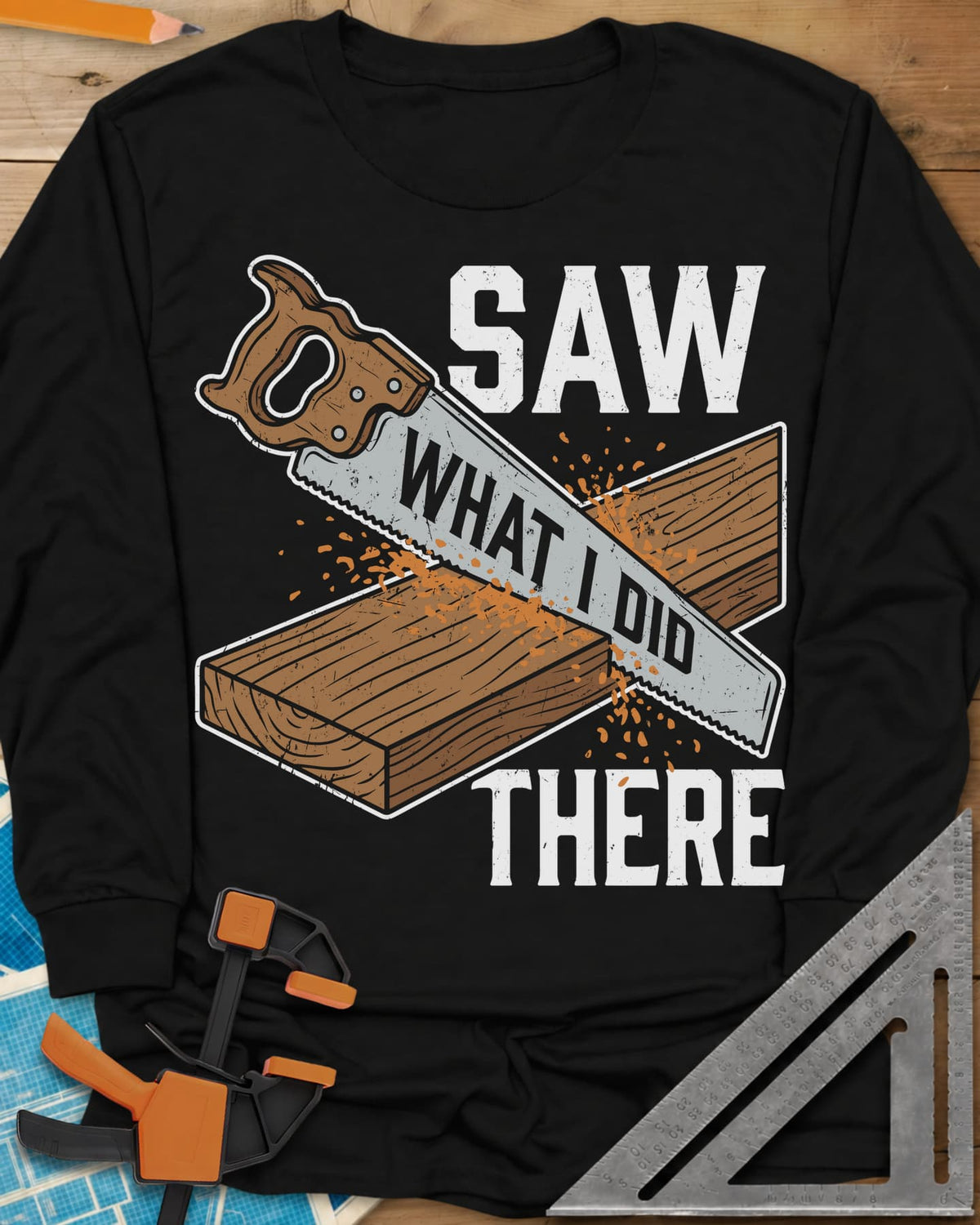 Saw What I Did long sleeve shirt in Black, a hand saw cutting a plank with WHAT I DID lettered on its blade