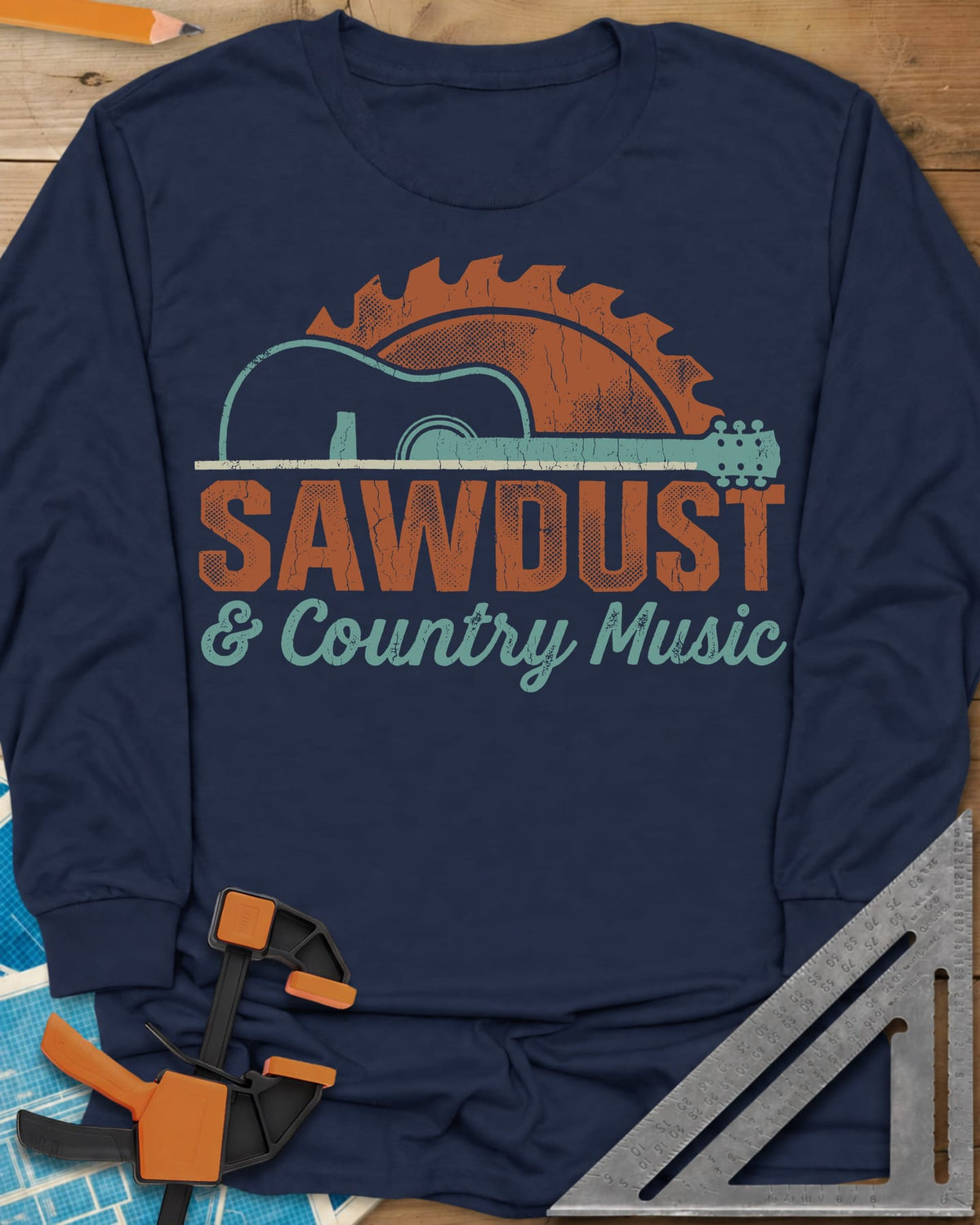 Sawdust And Country Music long sleeve shirt in Navy, an acoustic guitar in front of a rising saw blade
