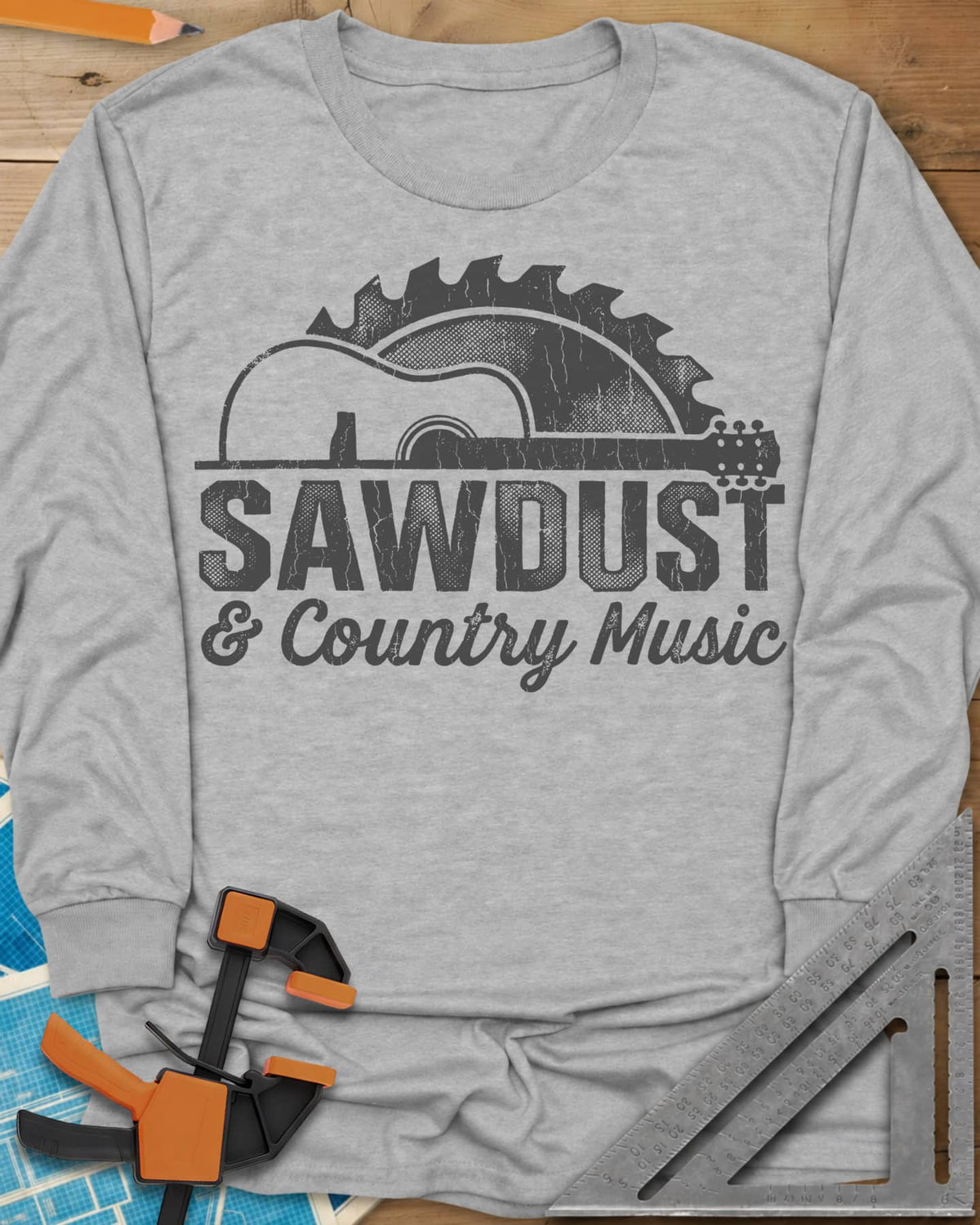 Sawdust And Country Music long sleeve shirt in Sport Grey, an acoustic guitar in front of a rising saw blade