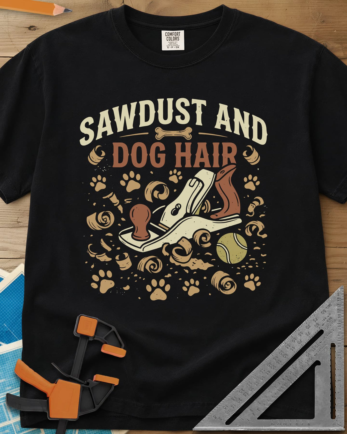 Sawdust And Dog Hair heavyweight tee in Black, hand plane, wood curls, paw prints and a tennis ball