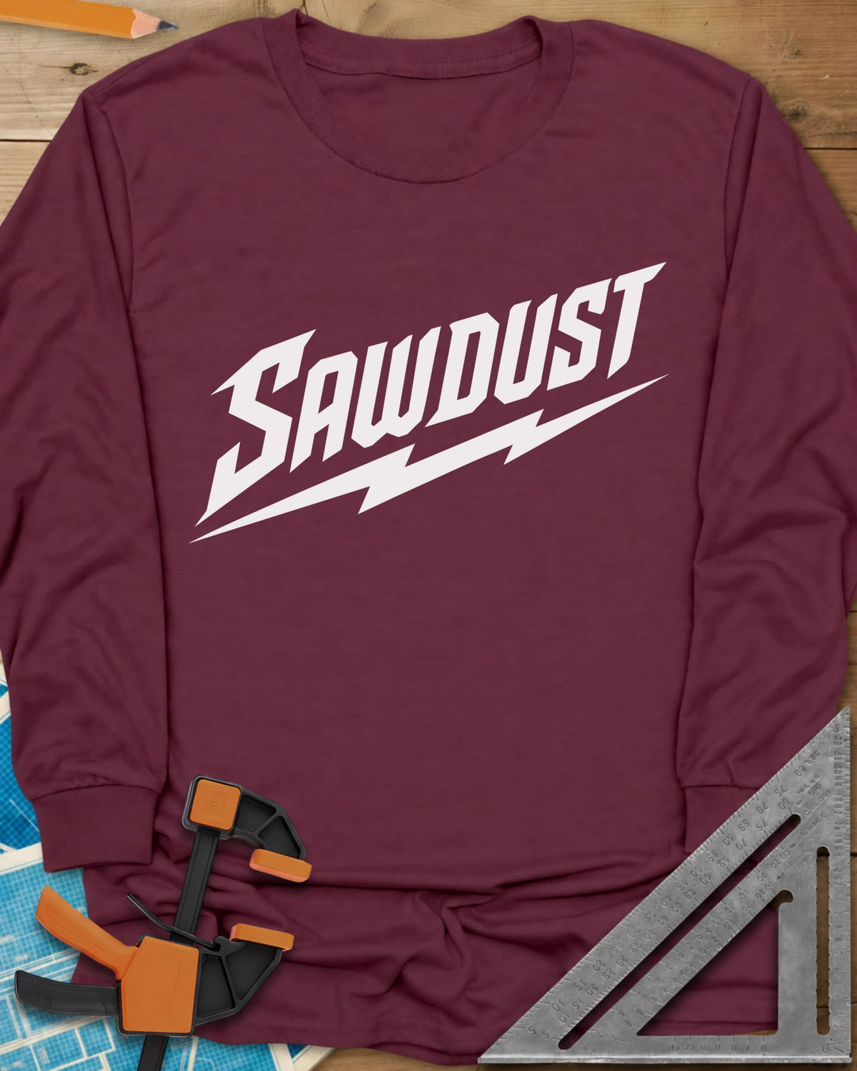 Sawdust Bolt long sleeve shirt in Maroon, bold slanted SAWDUST lettering with a lightning bolt underneath