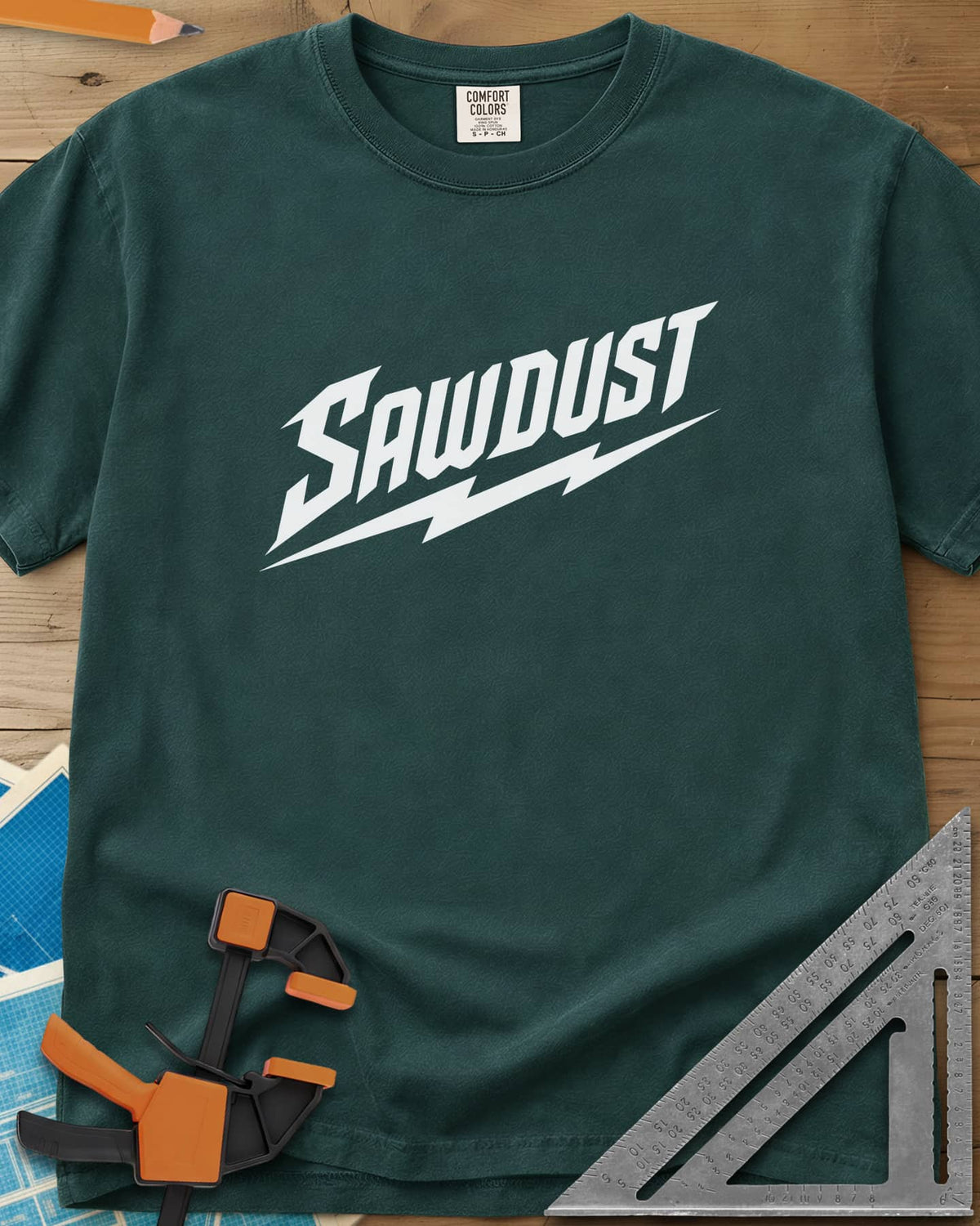 Sawdust Bolt heavyweight tee in Blue Spruce, bold slanted SAWDUST lettering with a lightning bolt underneath