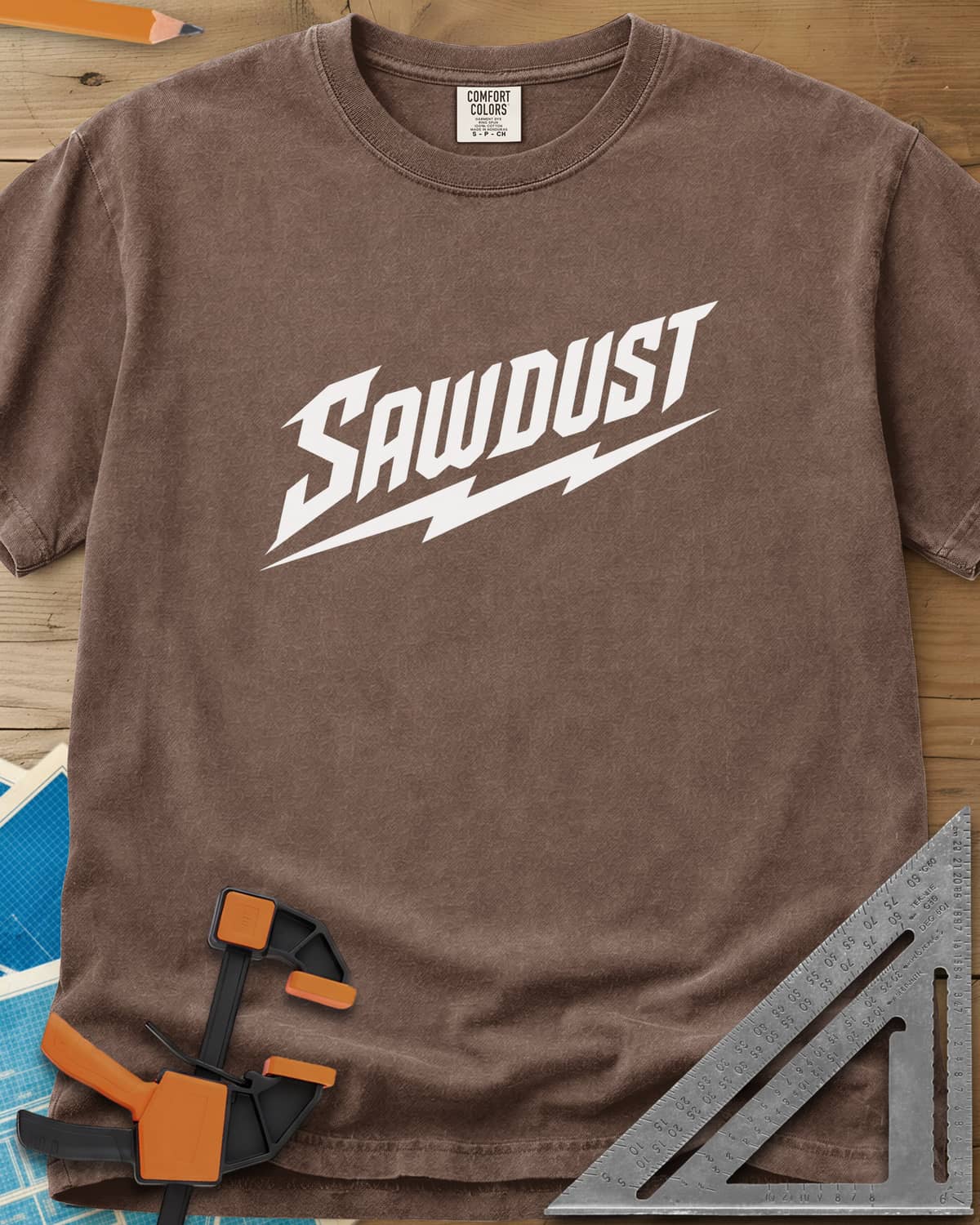 Sawdust Bolt heavyweight tee in Espresso, bold slanted SAWDUST lettering with a lightning bolt underneath