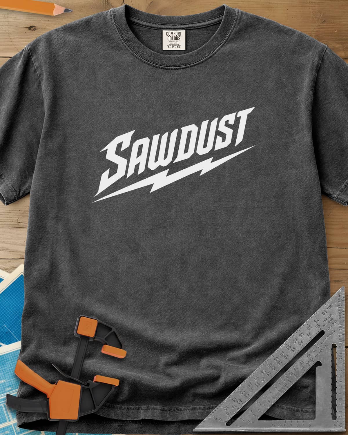 Sawdust Bolt heavyweight tee in Pepper, bold slanted SAWDUST lettering with a lightning bolt underneath