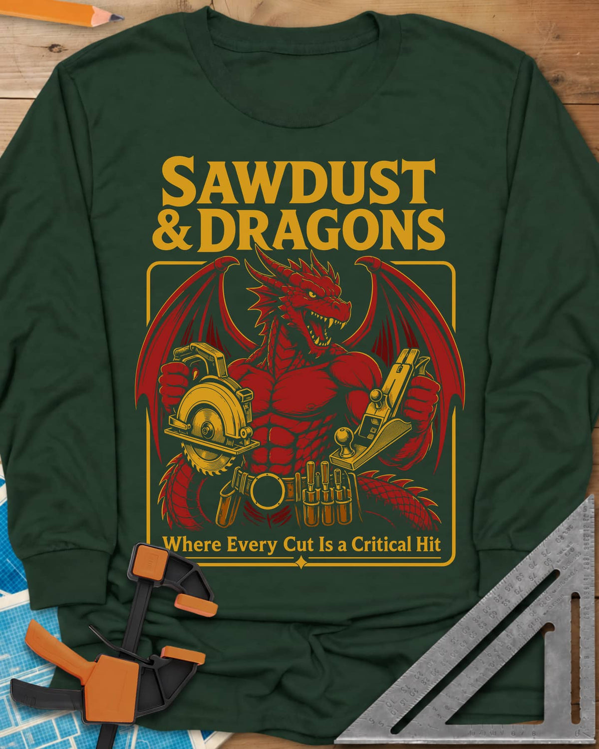 Sawdust & Dragons long sleeve shirt in Forest Green, red dragon in a tool belt holding a circular saw and a hand plane