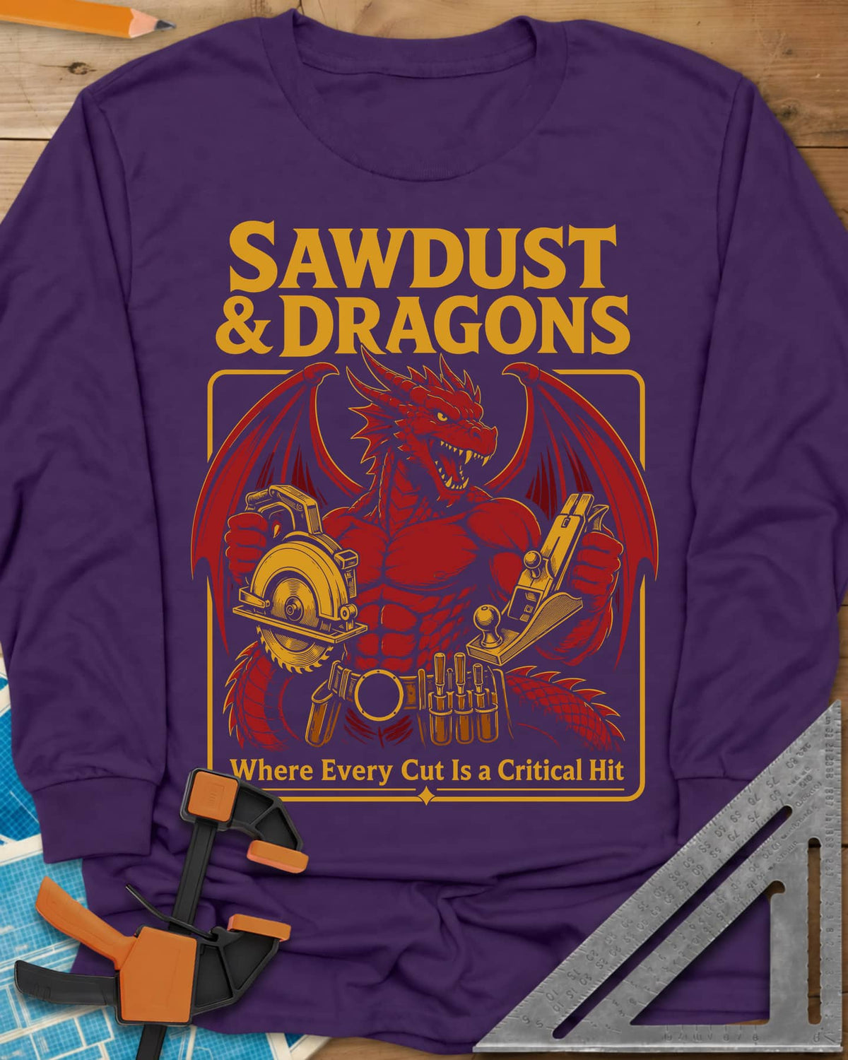Sawdust & Dragons long sleeve shirt in Purple, red dragon in a tool belt holding a circular saw and a hand plane