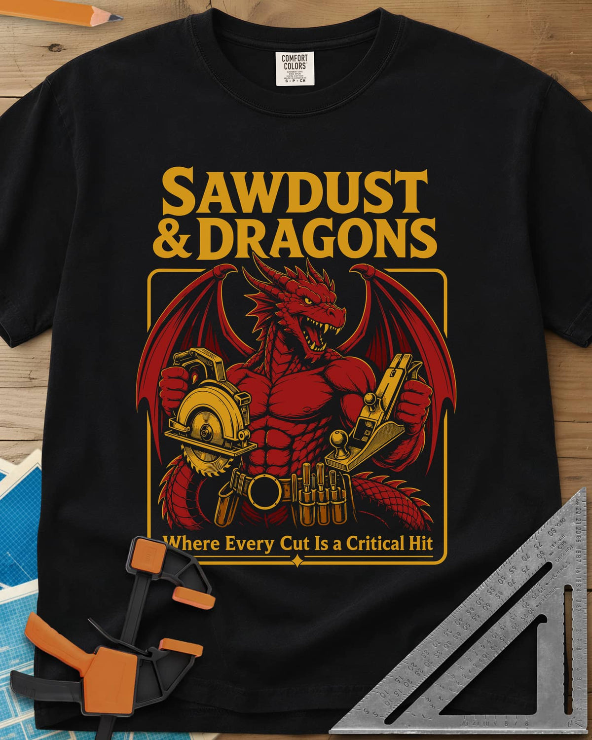 Sawdust & Dragons heavyweight tee in Black, red dragon in a tool belt holding a circular saw and a hand plane