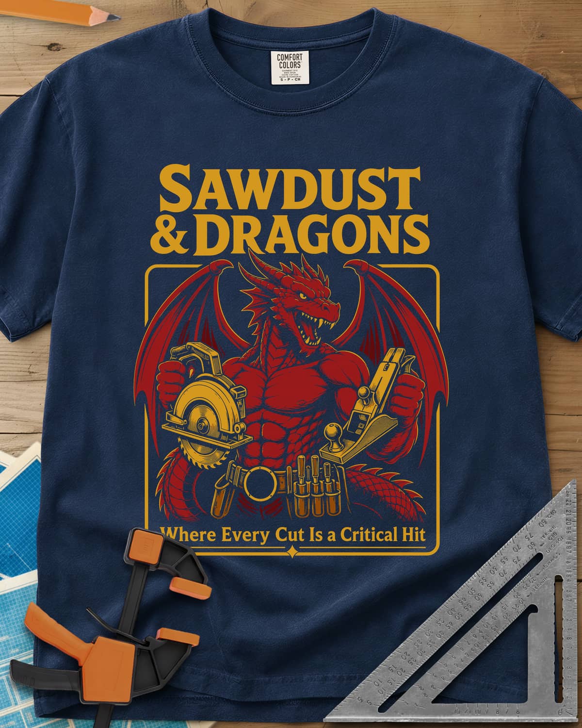 Sawdust & Dragons heavyweight tee in Navy, red dragon in a tool belt holding a circular saw and a hand plane