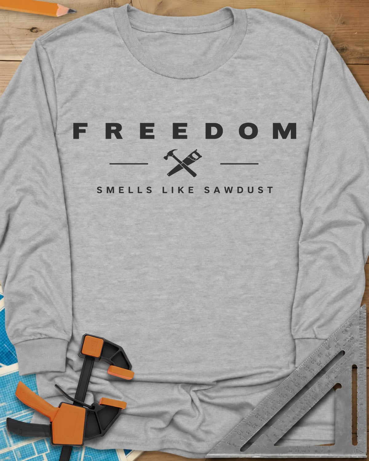 Sawdust Freedom long sleeve shirt in Sport Grey, crossed hammer and saw icon between two lines, wide-spaced lettering