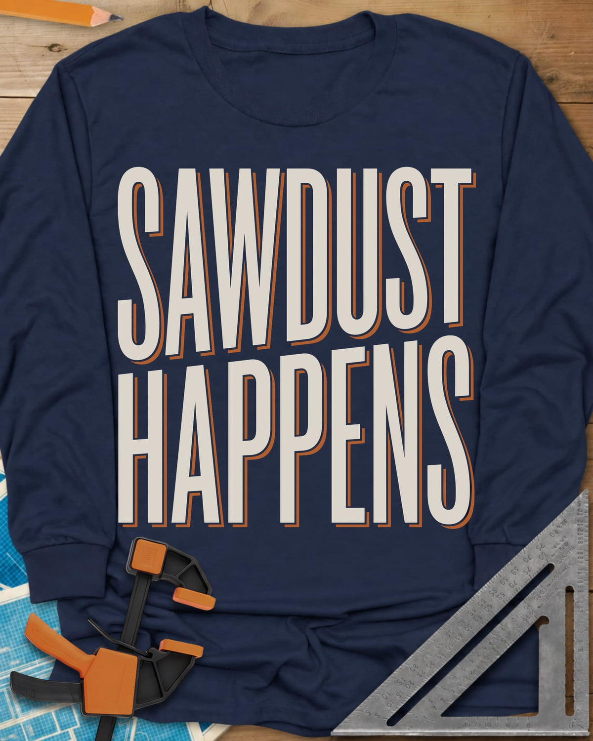 Sawdust Happens long sleeve shirt in Navy, tall condensed block letters with an offset shadow