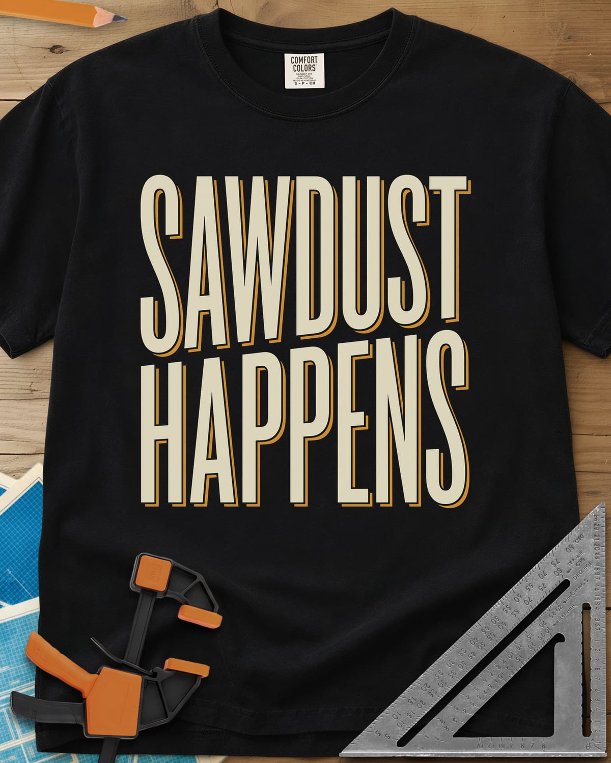 Sawdust Happens heavyweight tee in Black, tall condensed block letters with an offset shadow