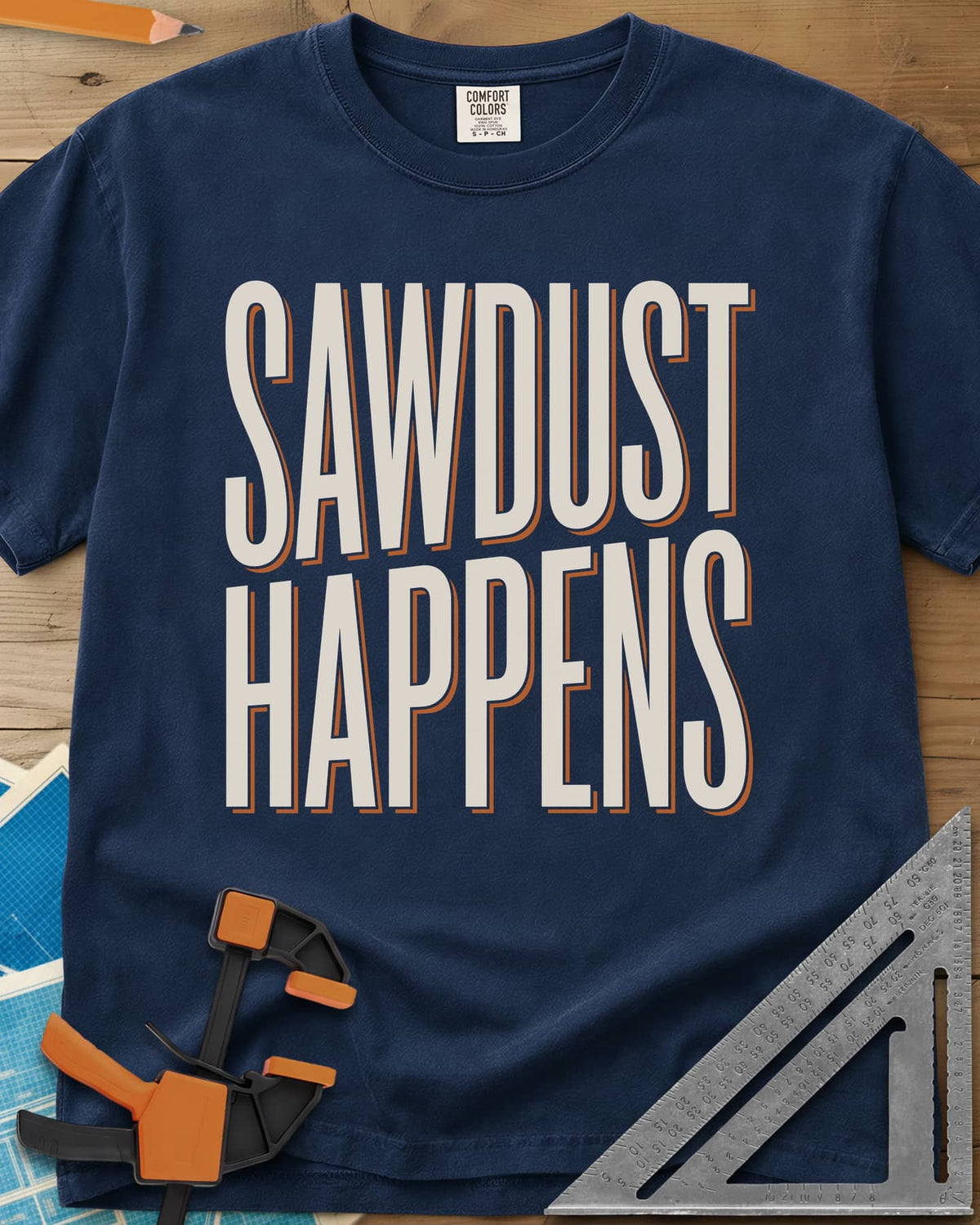 Sawdust Happens heavyweight tee in Navy, tall condensed block letters with an offset shadow