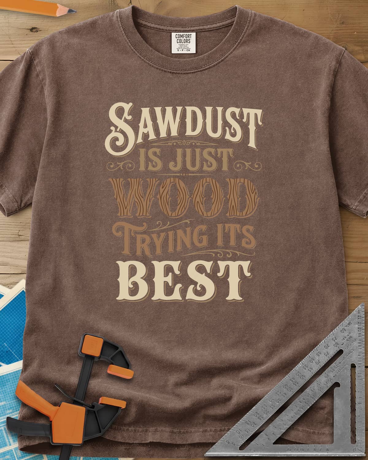 Sawdust Is Just Wood Trying Its Best heavyweight tee in Espresso, ornate vintage lettering with a wood-grain filled WOOD