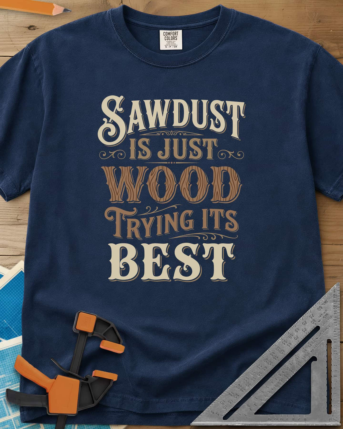 Sawdust Is Just Wood Trying Its Best heavyweight tee in Navy, ornate vintage lettering with a wood-grain filled WOOD