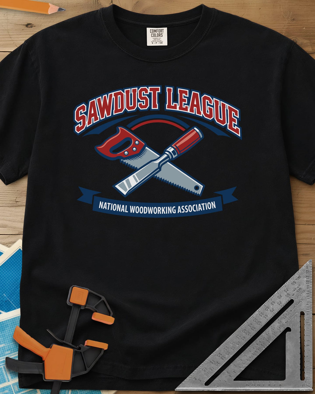 Sawdust League heavyweight tee in Black, varsity badge with a crossed hand saw and chisel and a ribbon