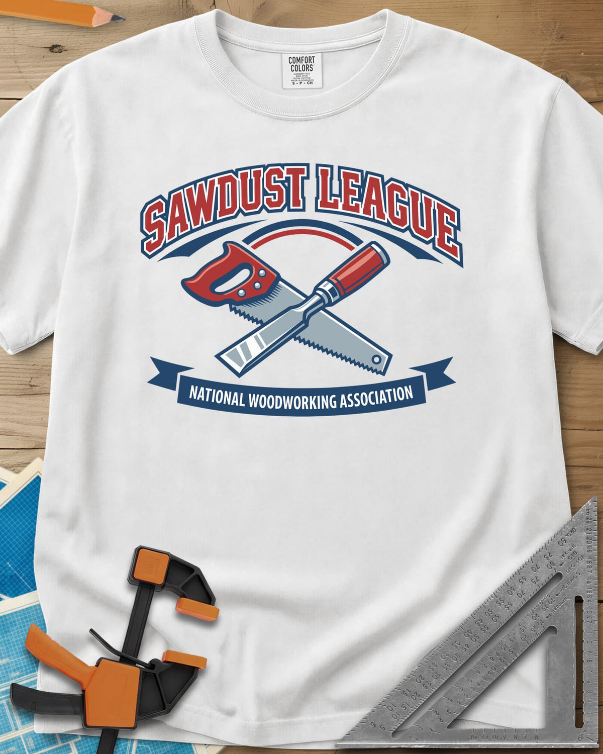 Sawdust League heavyweight tee in White, varsity badge with a crossed hand saw and chisel and a ribbon