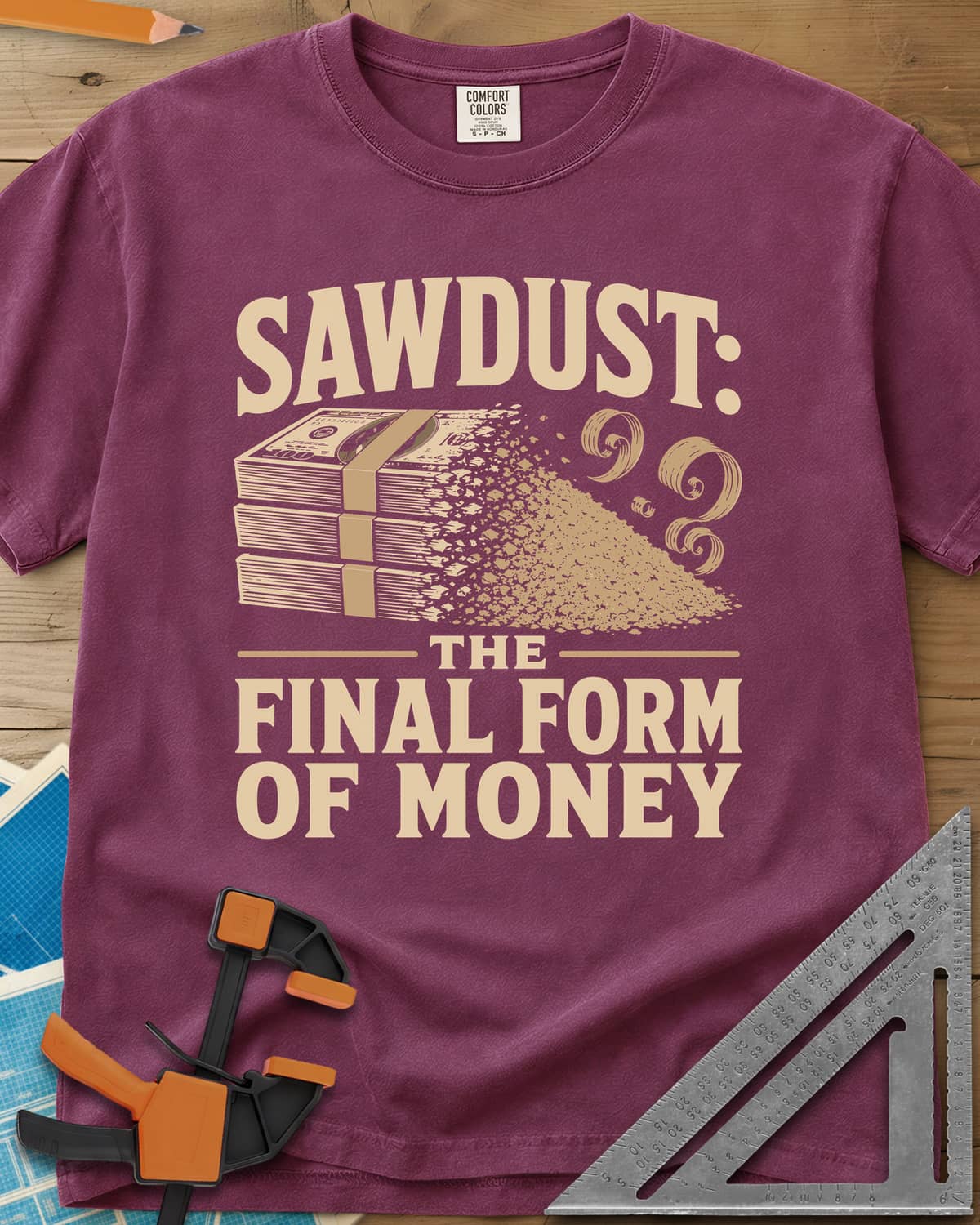 Sawdust The Final Form Of Money heavyweight tee in Berry, a stack of bills crumbling into a pile of sawdust and curls