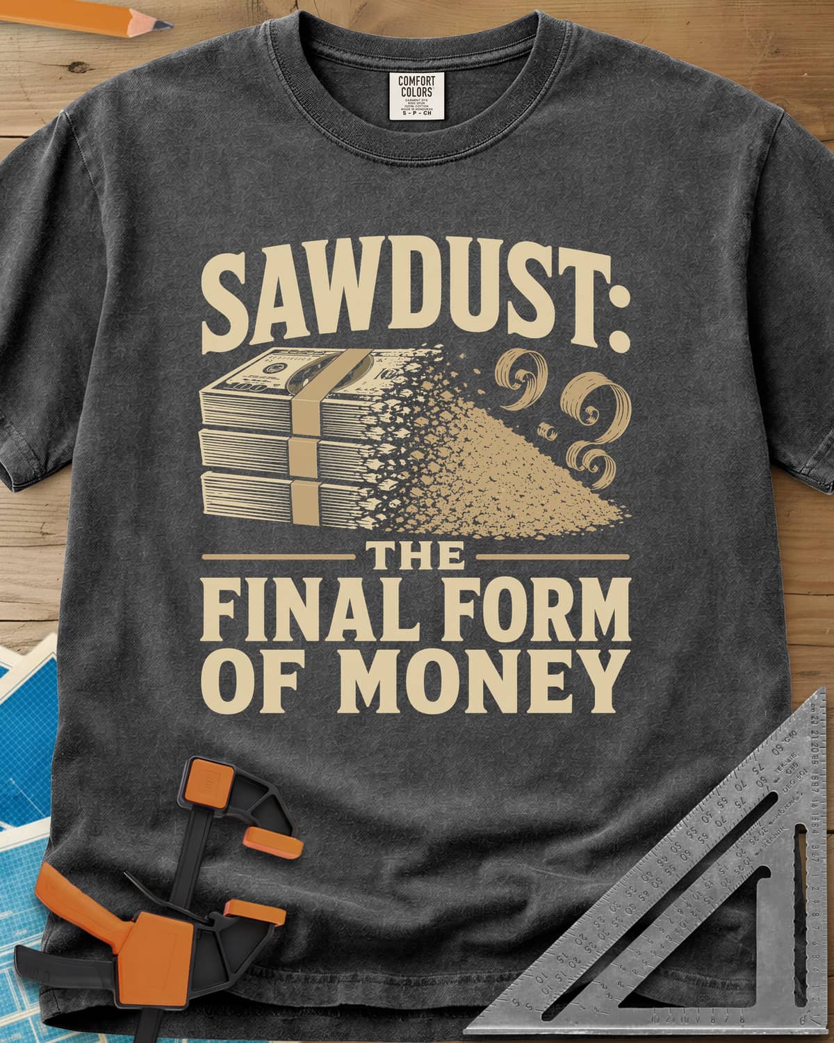 Sawdust The Final Form Of Money heavyweight tee in Pepper, a stack of bills crumbling into a pile of sawdust and curls