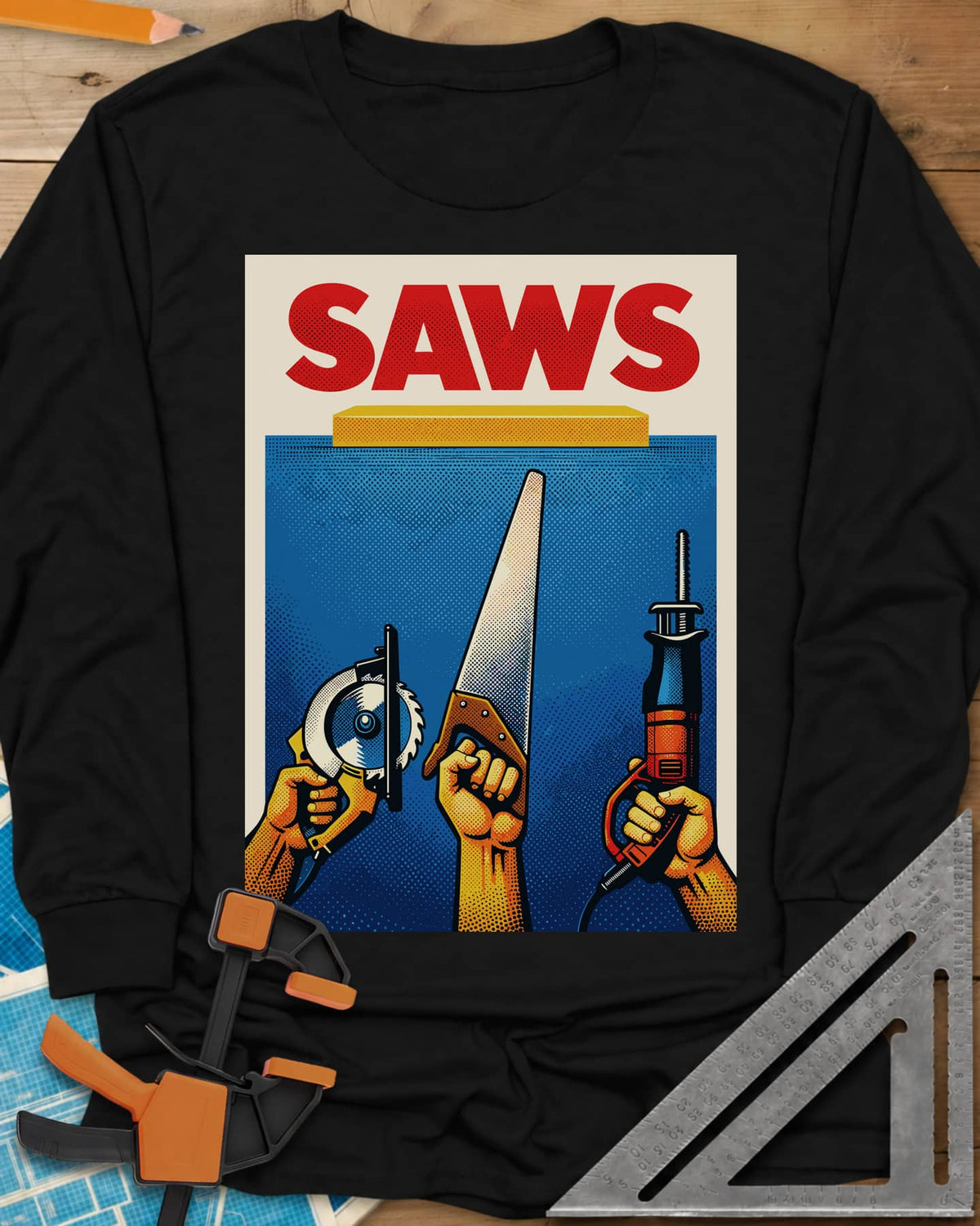 Saws Tool Pride long sleeve shirt in Black, three hands raising a circular saw, handsaw and reciprocating saw