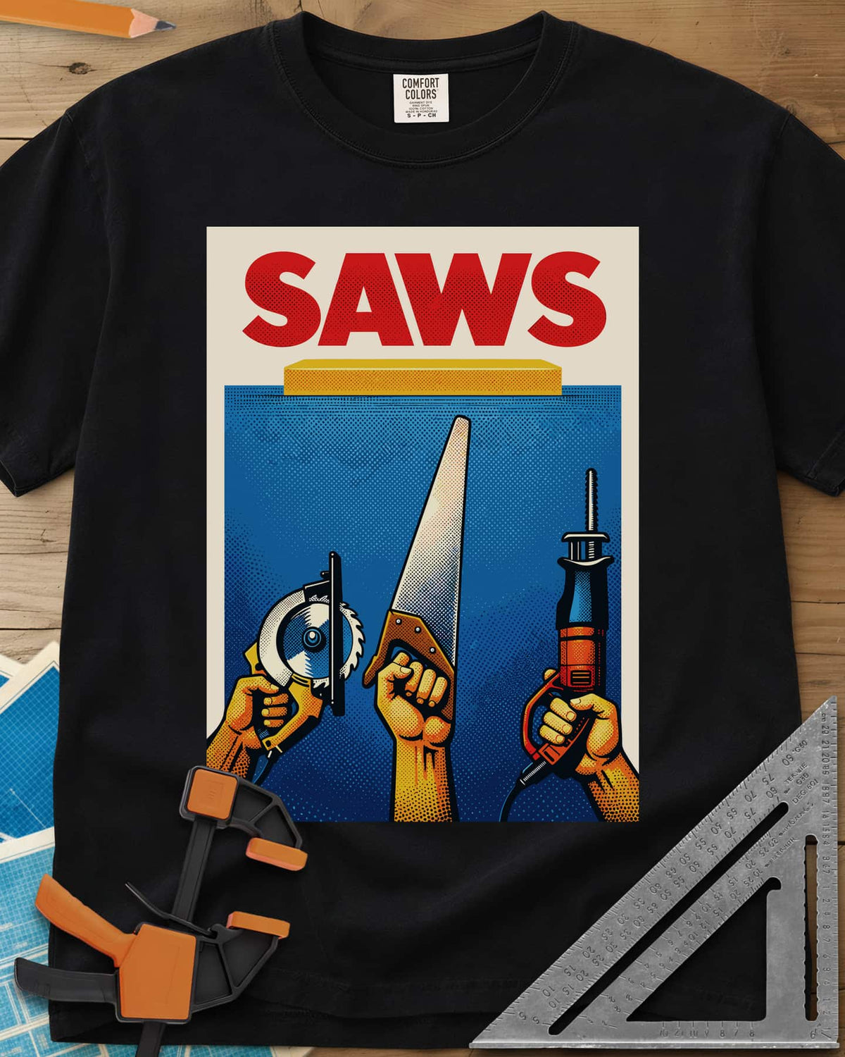 Saws Tool Pride heavyweight tee in Black, three hands raising a circular saw, handsaw and reciprocating saw
