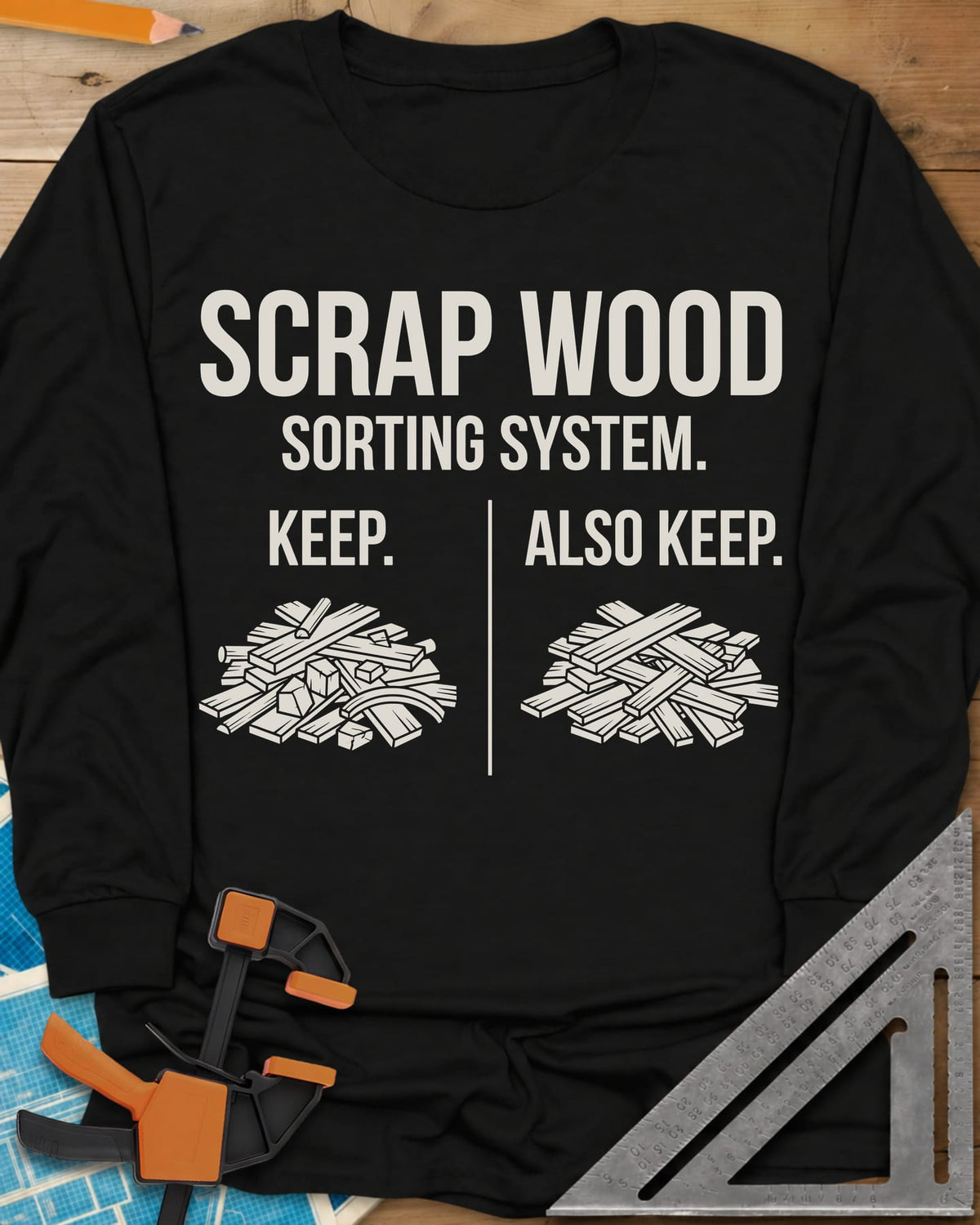 Scrap Wood Sorting System long sleeve shirt in Black, two piles of scrap lumber split by a thin vertical line