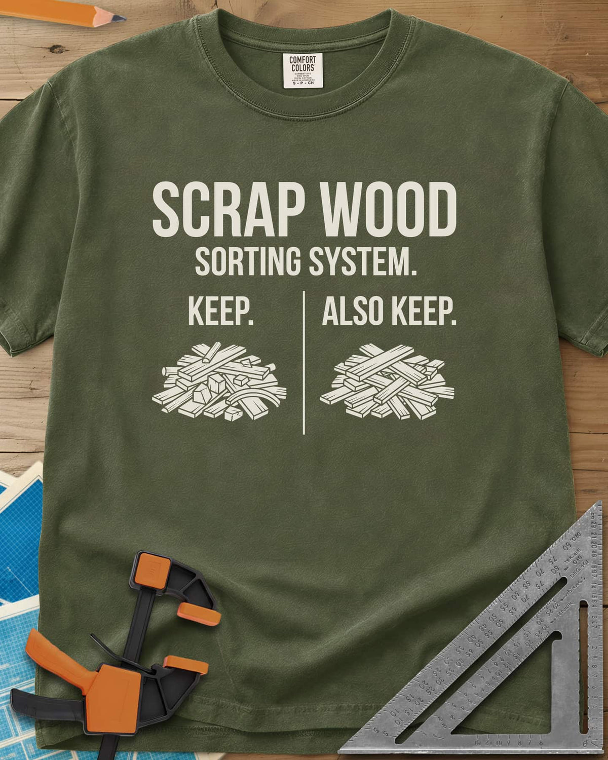 Scrap Wood Sorting System heavyweight tee in Hemp, two piles of scrap lumber split by a thin vertical line
