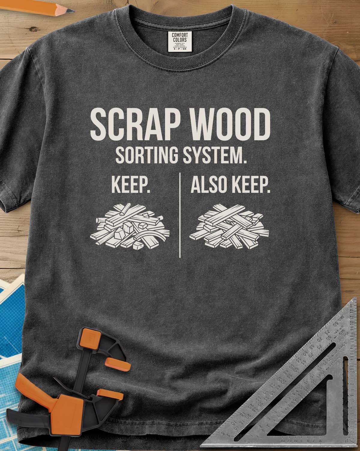 Scrap Wood Sorting System heavyweight tee in Pepper, two piles of scrap lumber split by a thin vertical line