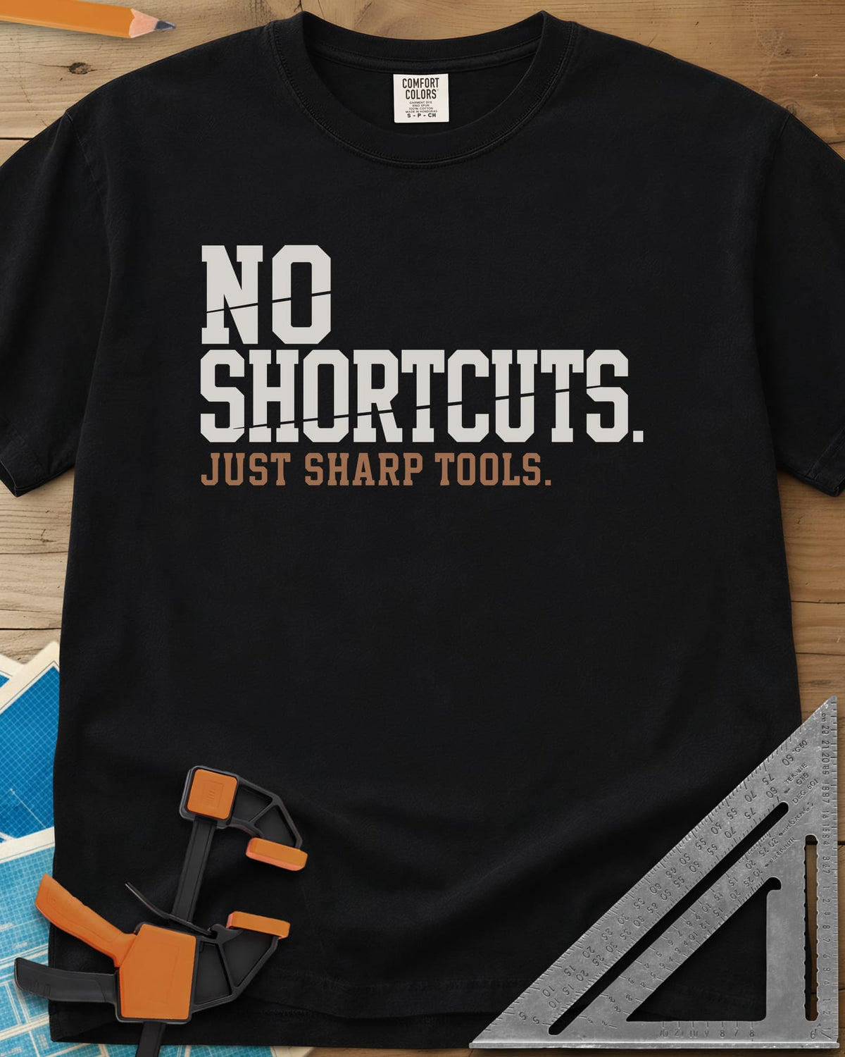 Sharp Tools heavyweight tee in Black, bold slab letters with a thin slice cut through them