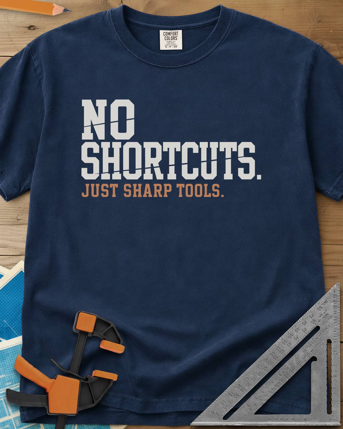 Sharp Tools heavyweight tee in Navy, bold slab letters with a thin slice cut through them