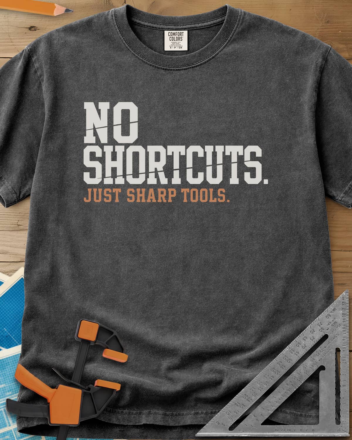 Sharp Tools heavyweight tee in Pepper, bold slab letters with a thin slice cut through them