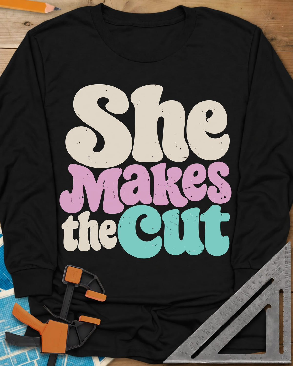 She Makes The Cut long sleeve shirt in Black, chunky retro lettering in cream, pink and teal