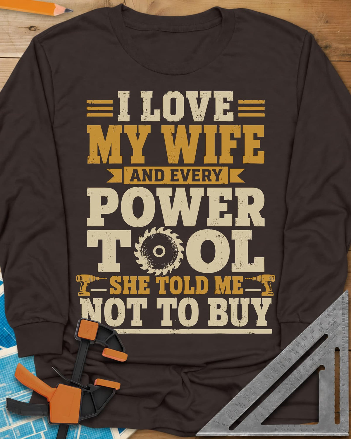 She Told Me Not To Buy Power Tools long sleeve shirt in Dark Chocolate, stacked lettering with a saw blade for the O and two