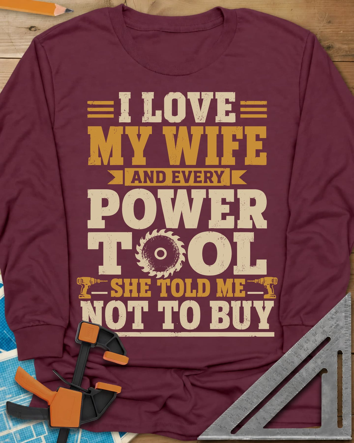 She Told Me Not To Buy Power Tools long sleeve shirt in Maroon, stacked lettering with a saw blade for the O and two