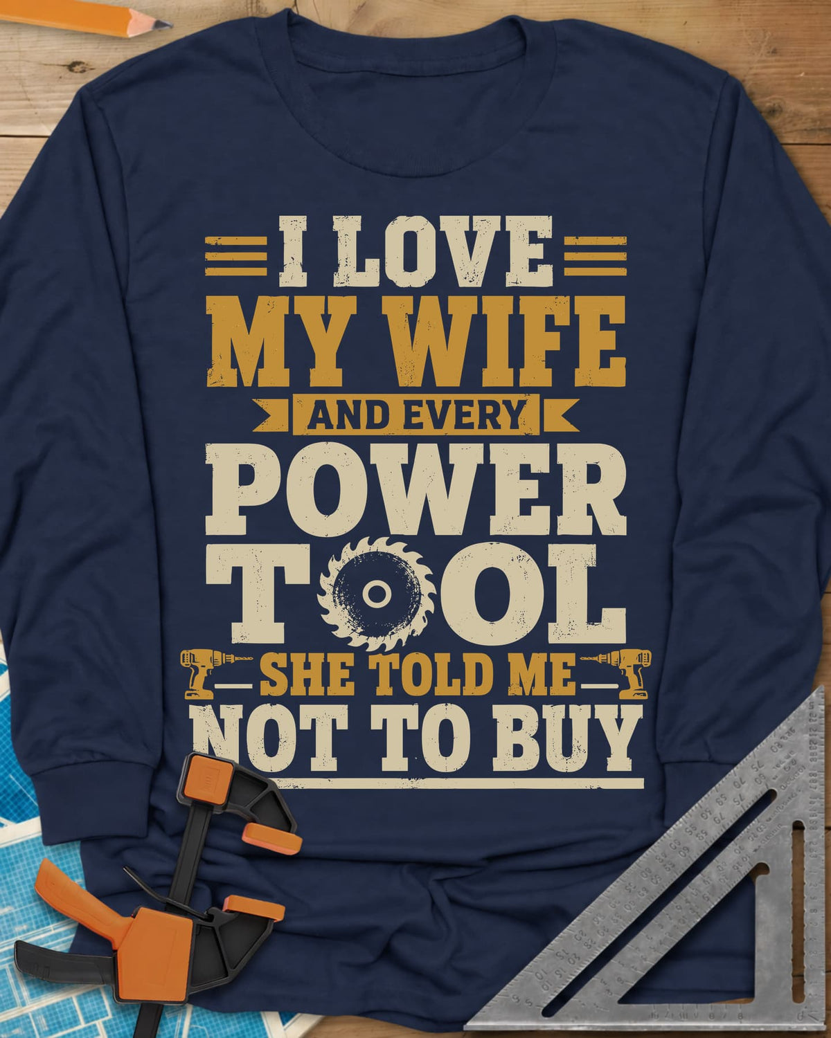 She Told Me Not To Buy Power Tools long sleeve shirt in Navy, stacked lettering with a saw blade for the O and two cordless