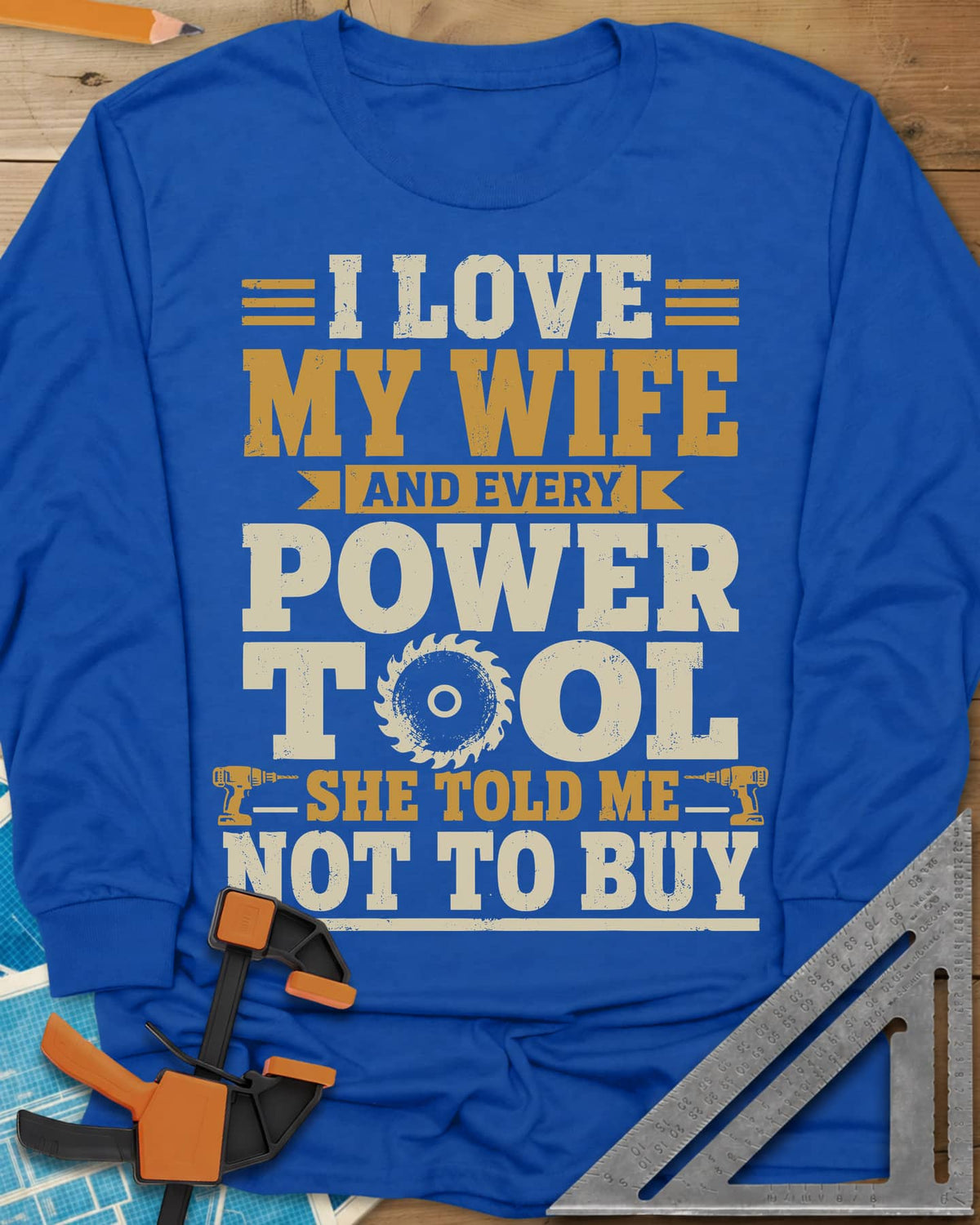 She Told Me Not To Buy Power Tools long sleeve shirt in Royal, stacked lettering with a saw blade for the O and two cordless
