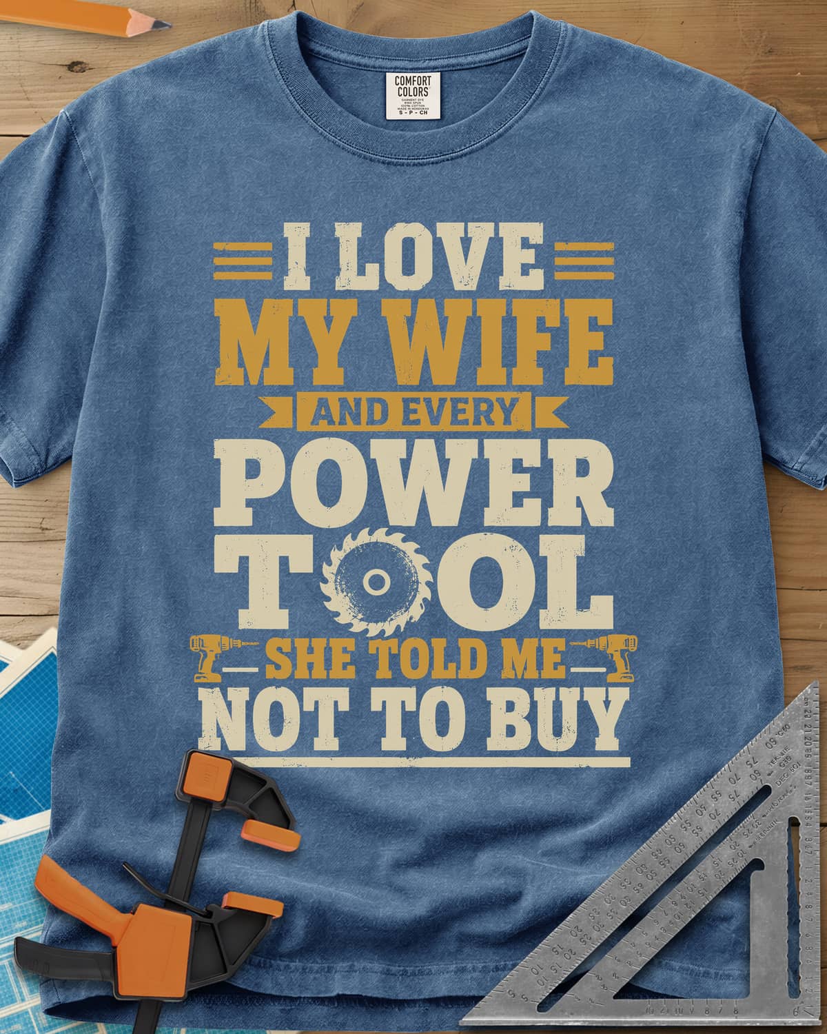 She Told Me Not To Buy Power Tools heavyweight tee in Blue Jean, stacked lettering with a saw blade for the O and two