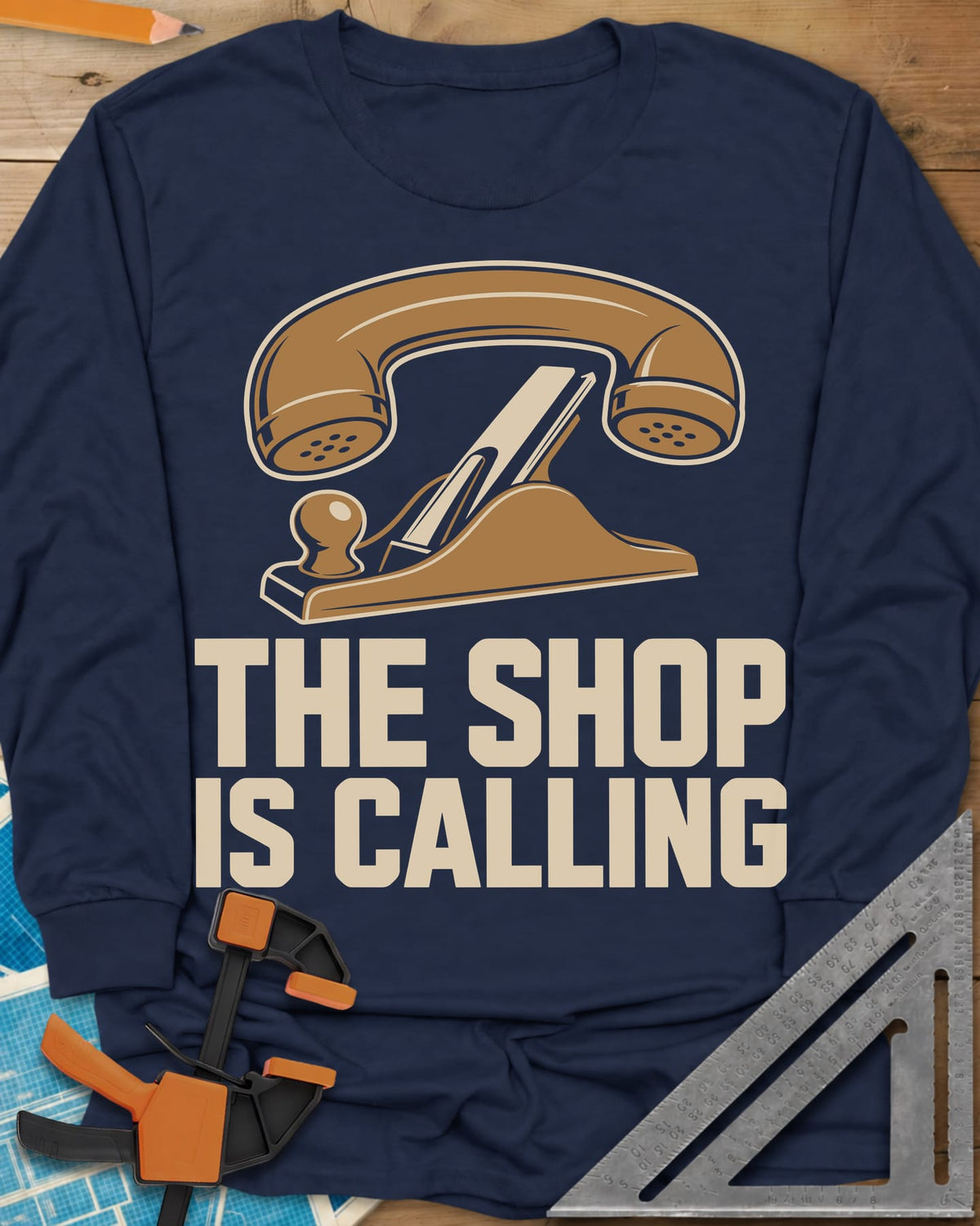 Shop Calling long sleeve shirt in Navy, an old telephone handset resting on a hand plane