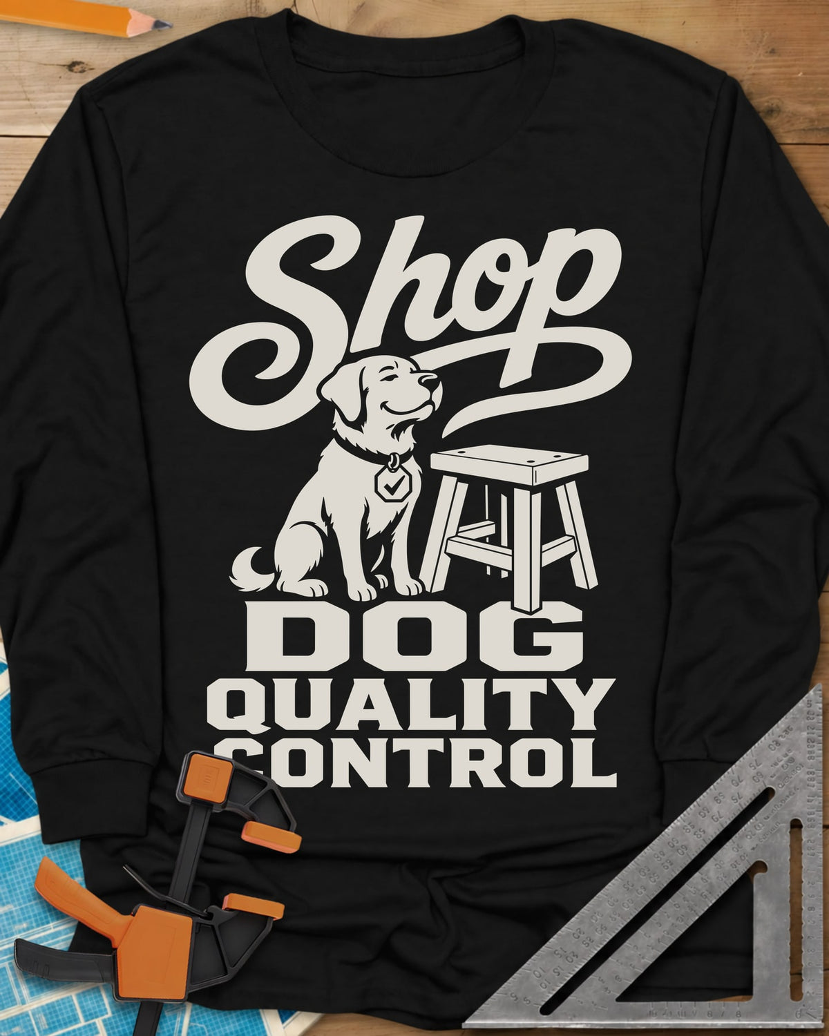 Shop Dog long sleeve shirt in Black, a seated dog with a check-mark tag beside a shop stool