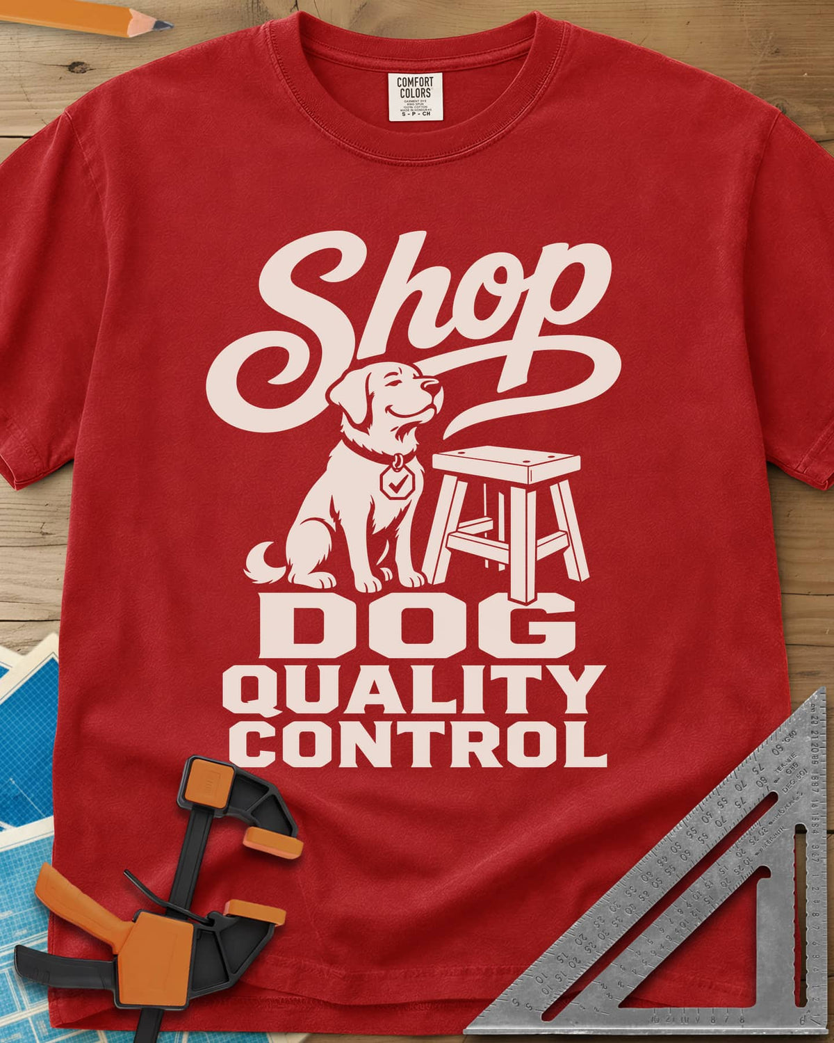 Shop Dog heavyweight tee in Red, a seated dog with a check-mark tag beside a shop stool