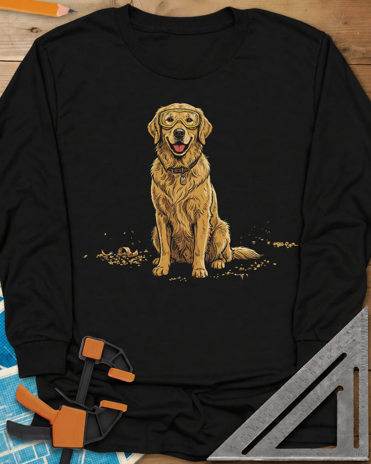 Shop Dog Safety First long sleeve shirt in Black, a golden retriever in safety goggles sitting in wood shavings