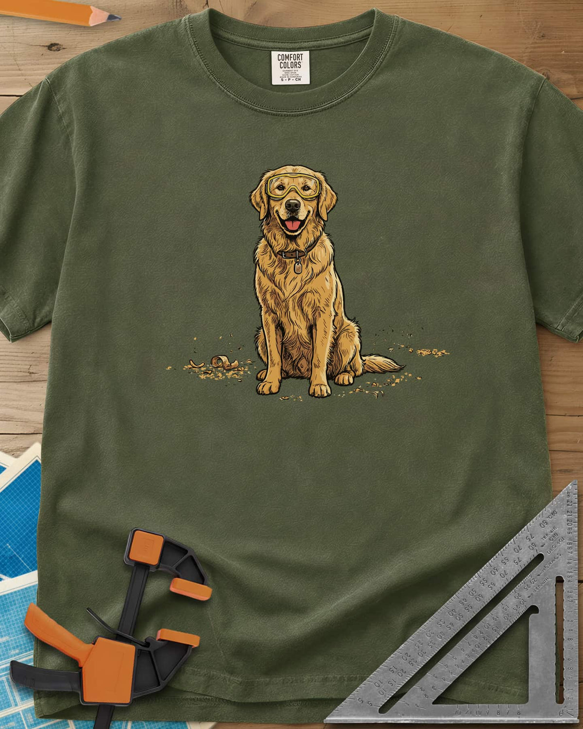 Shop Dog Safety First heavyweight tee in Hemp, a golden retriever in safety goggles sitting in wood shavings