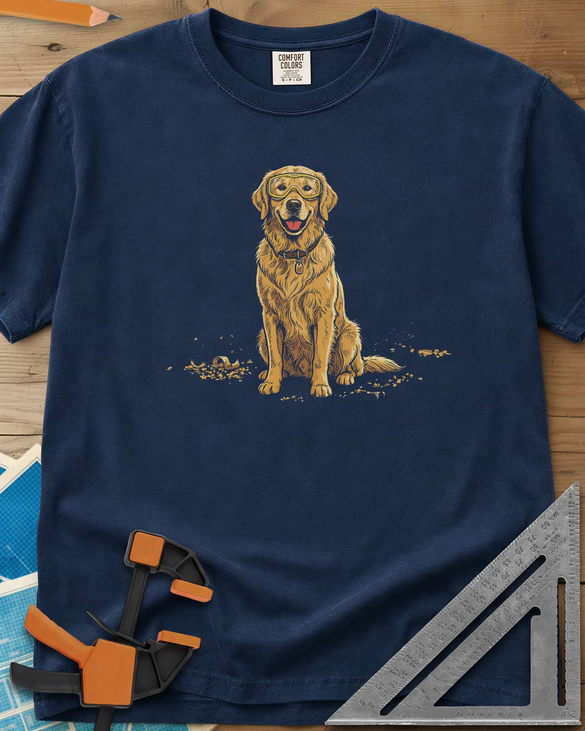 Shop Dog Safety First heavyweight tee in Navy, a golden retriever in safety goggles sitting in wood shavings